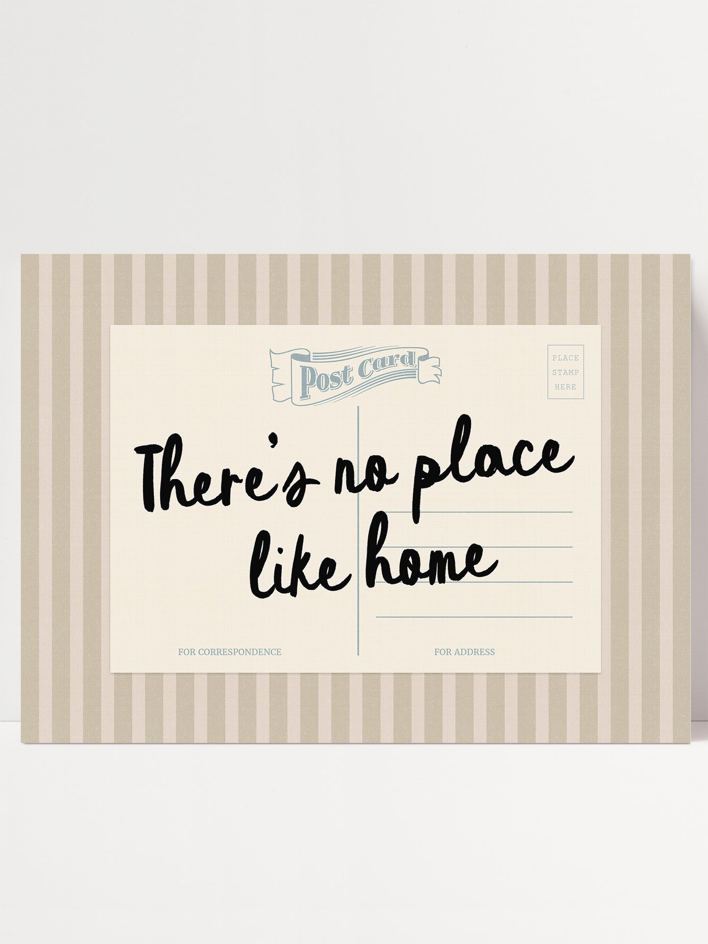 The image is a postcard with a handwritten message that reads "There's no place like home".