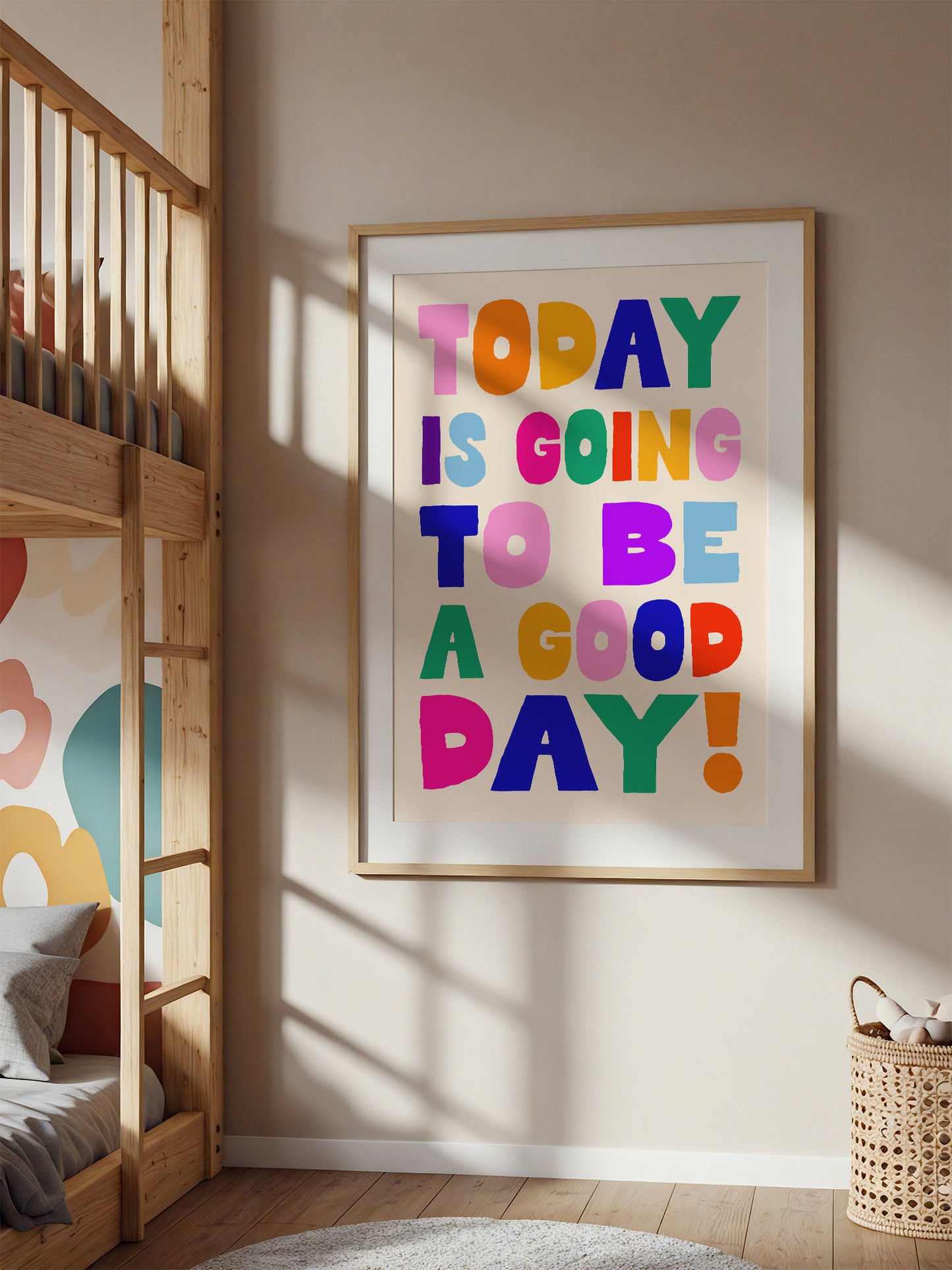 a colorful poster with the text "Today is going to be a good day!" displayed on a wall in a room with bunk beds.