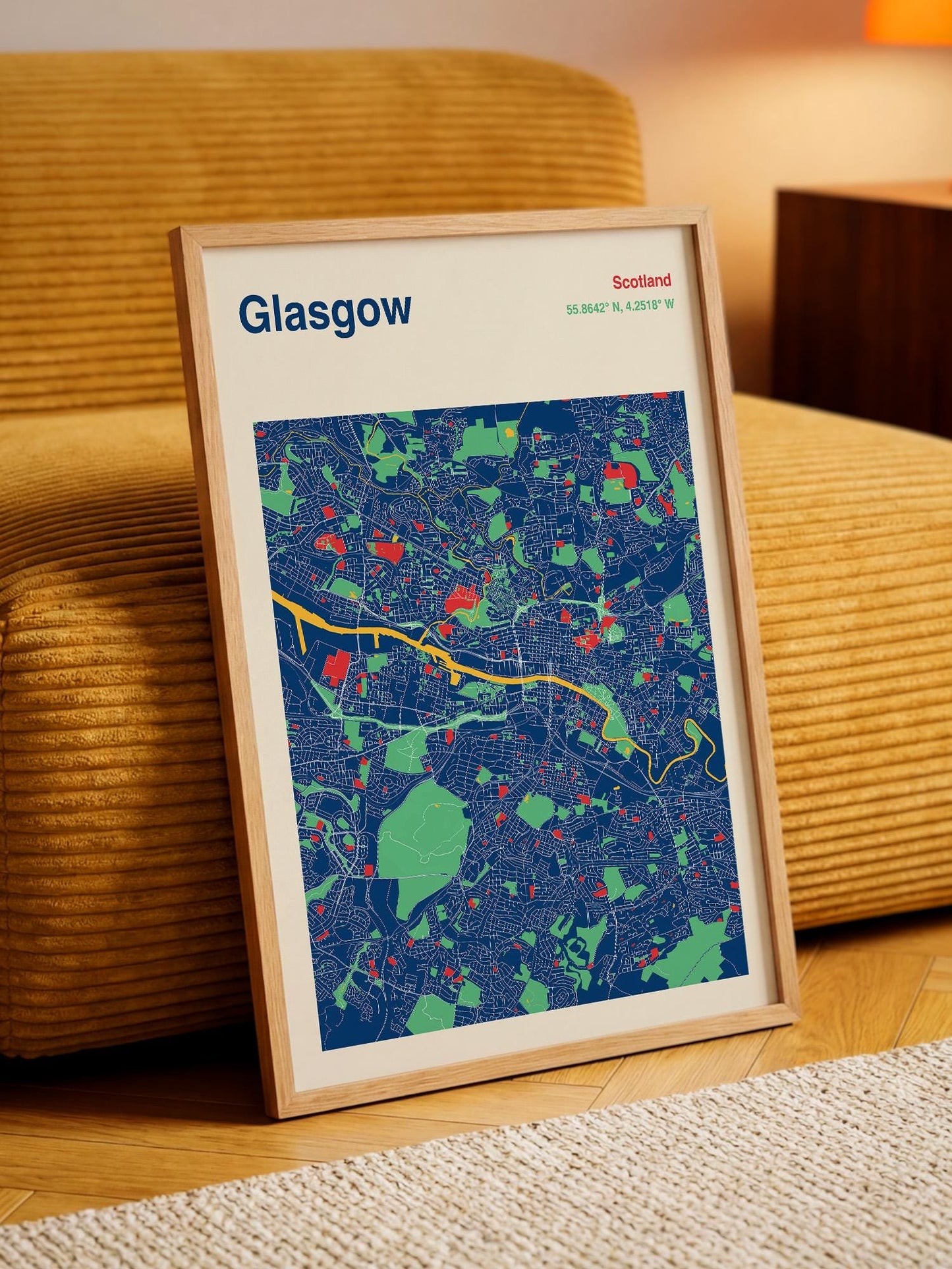 A framed map of Glasgow, Scotland, with a colorful and detailed representation of the city's streets and landmarks.