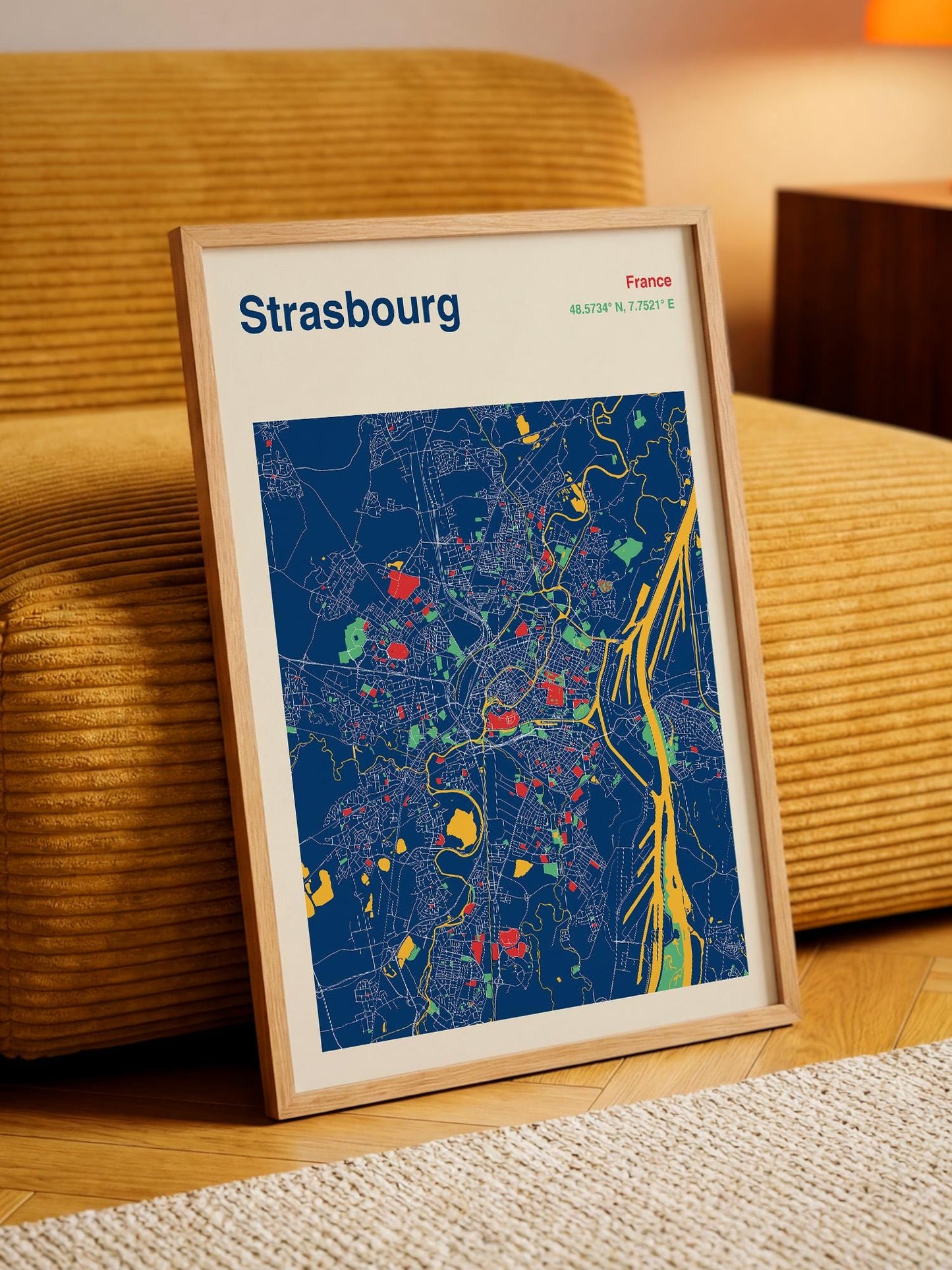 A framed map of Strasbourg, France, depicting the city's layout and various landmarks.