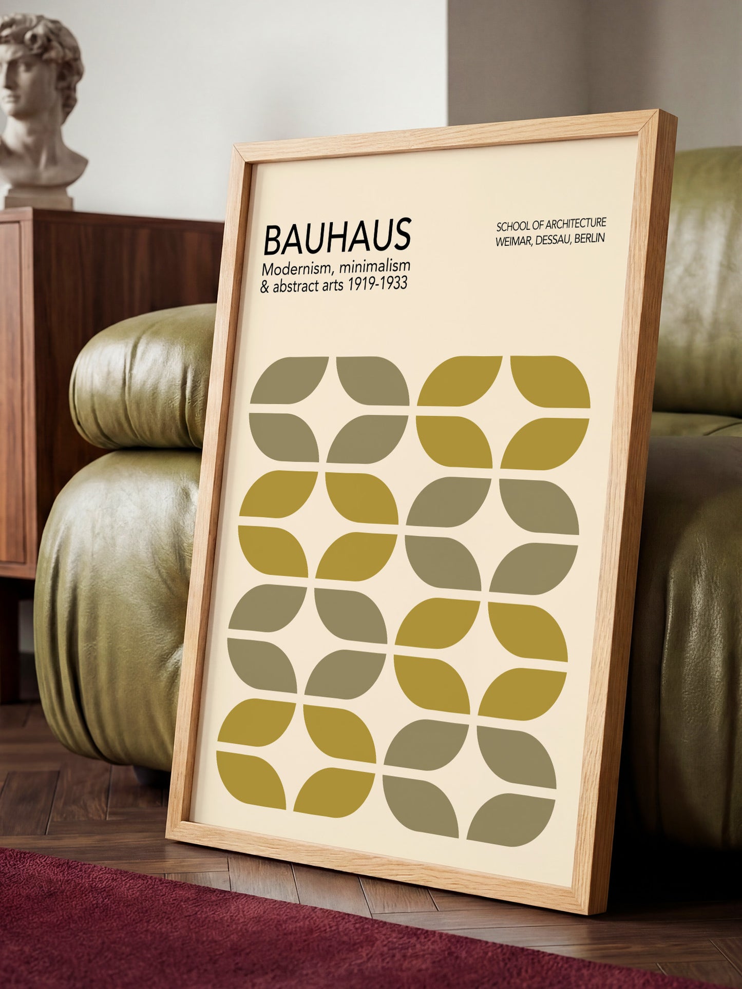 a framed poster of the Bauhaus school of architecture, with a minimalist design and a repeating pattern of green and yellow shapes.