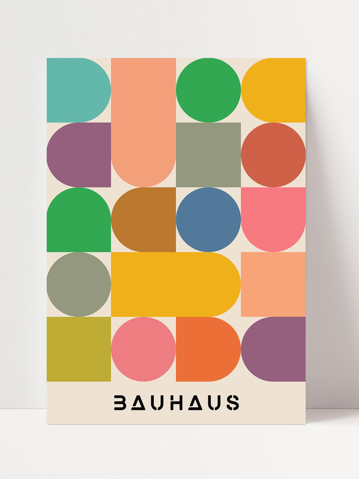 The image is a poster featuring a geometric design with various shapes and colors, including circles, squares, and rectangles, arranged in a grid-like pattern.