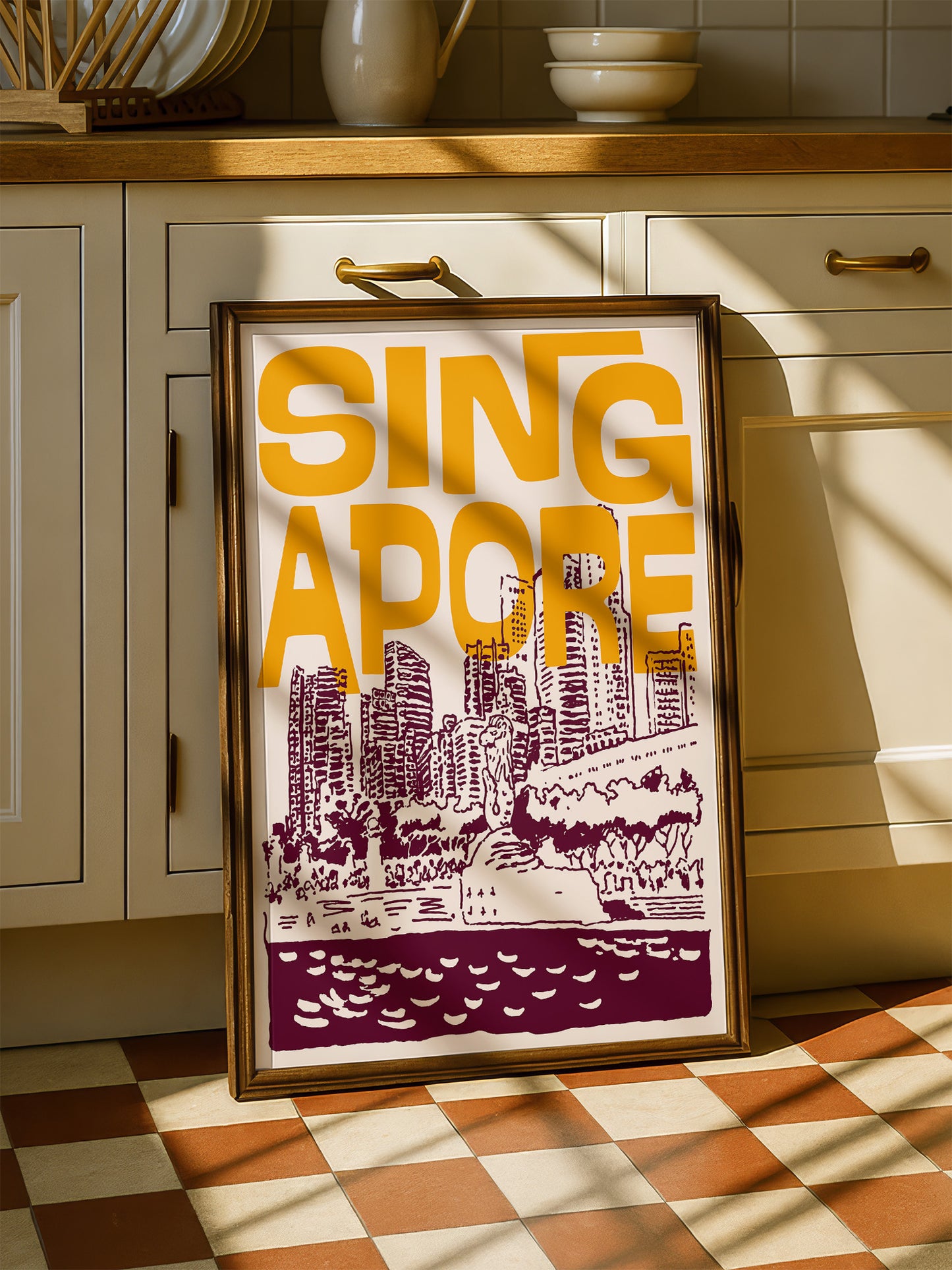 A framed poster of a cityscape with the text "SINGAPORE" prominently displayed, sitting on a checkered floor in a kitchen setting.
