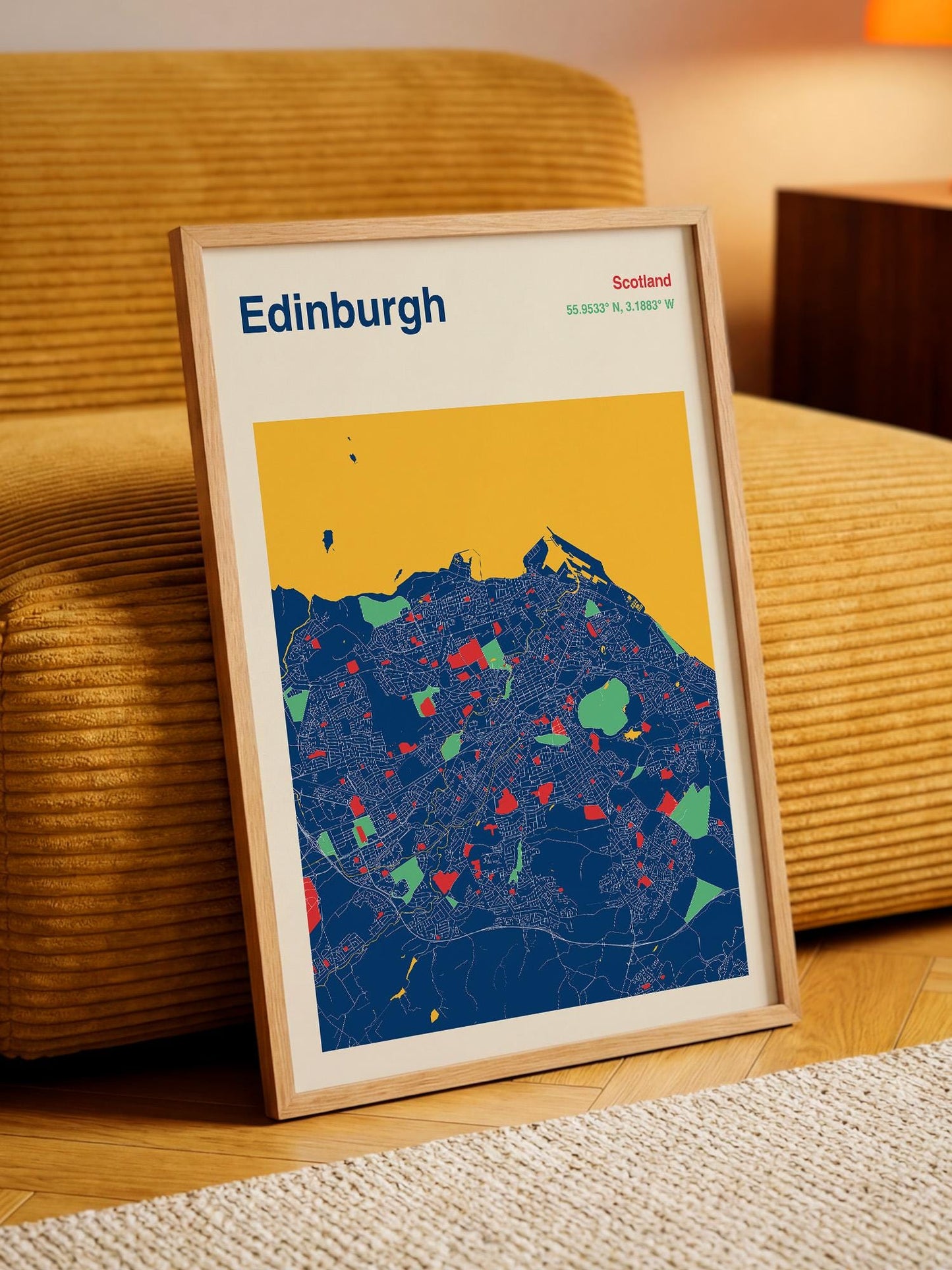 A framed map of Edinburgh, Scotland, with a colorful and detailed representation of the city's streets and landmarks.