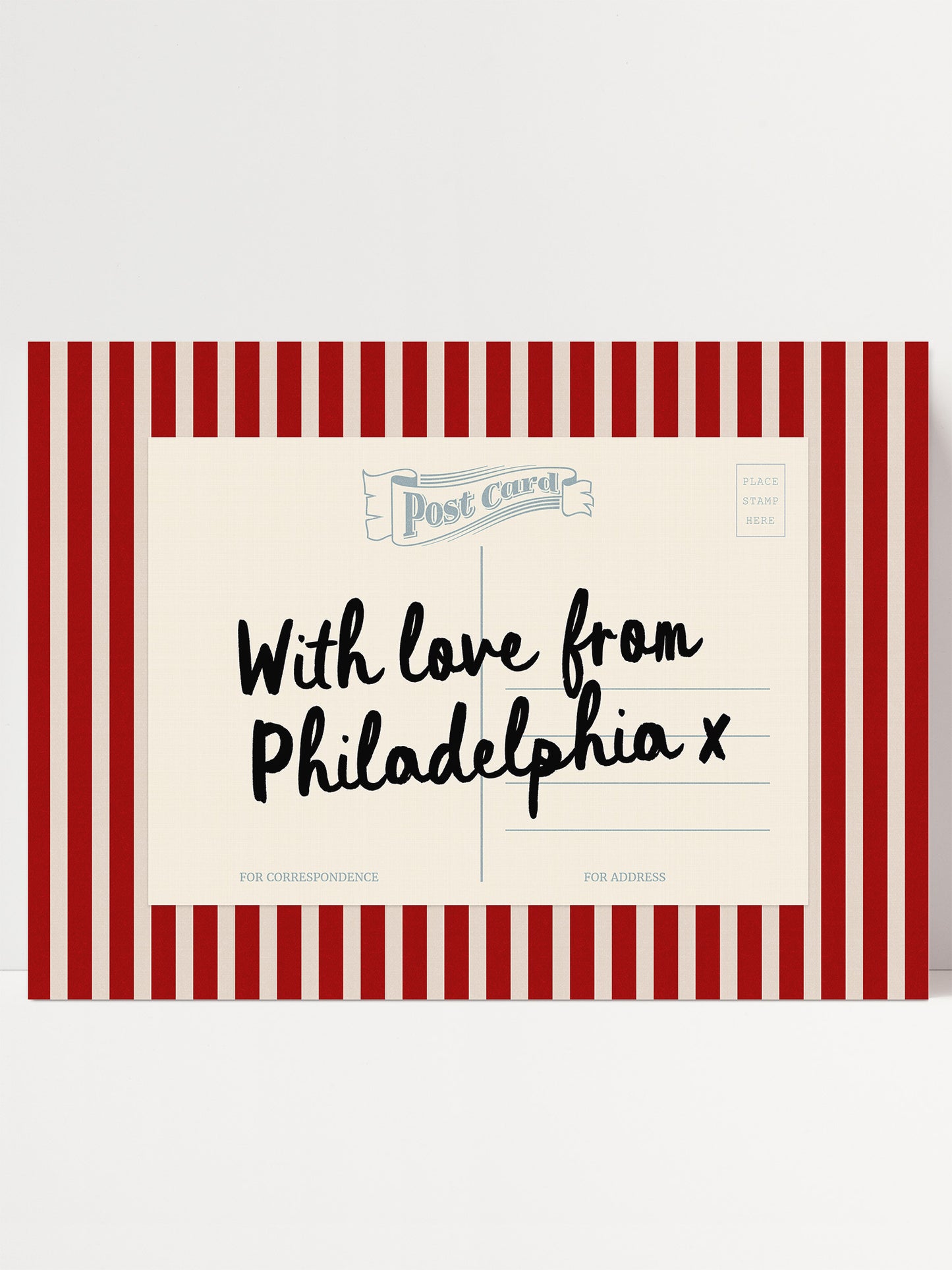A postcard with a red and white striped border, featuring handwritten text that reads "With love from Philadelphia x".