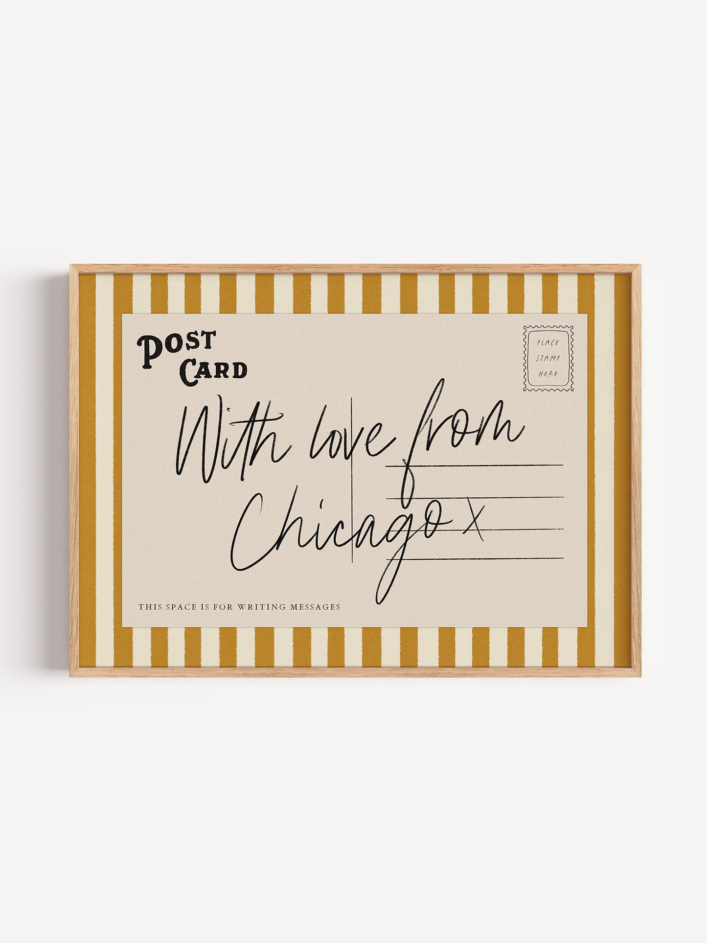 A framed postcard with handwritten text that reads "With love from Chicago x" and "This space is for writing messages".