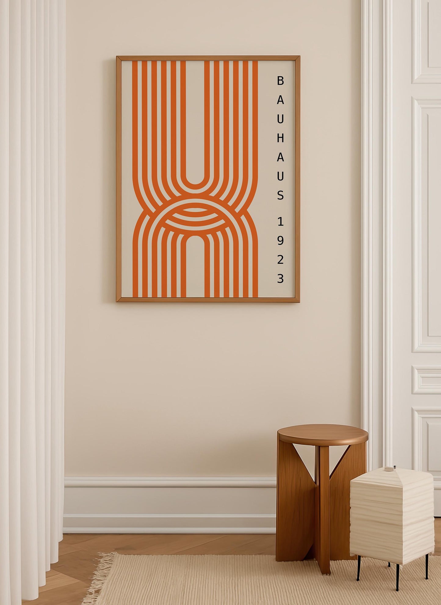a minimalist interior design with a large orange abstract art piece hanging on a beige wall. Below the art piece, there is a small wooden stool and a stack of white paper towels.