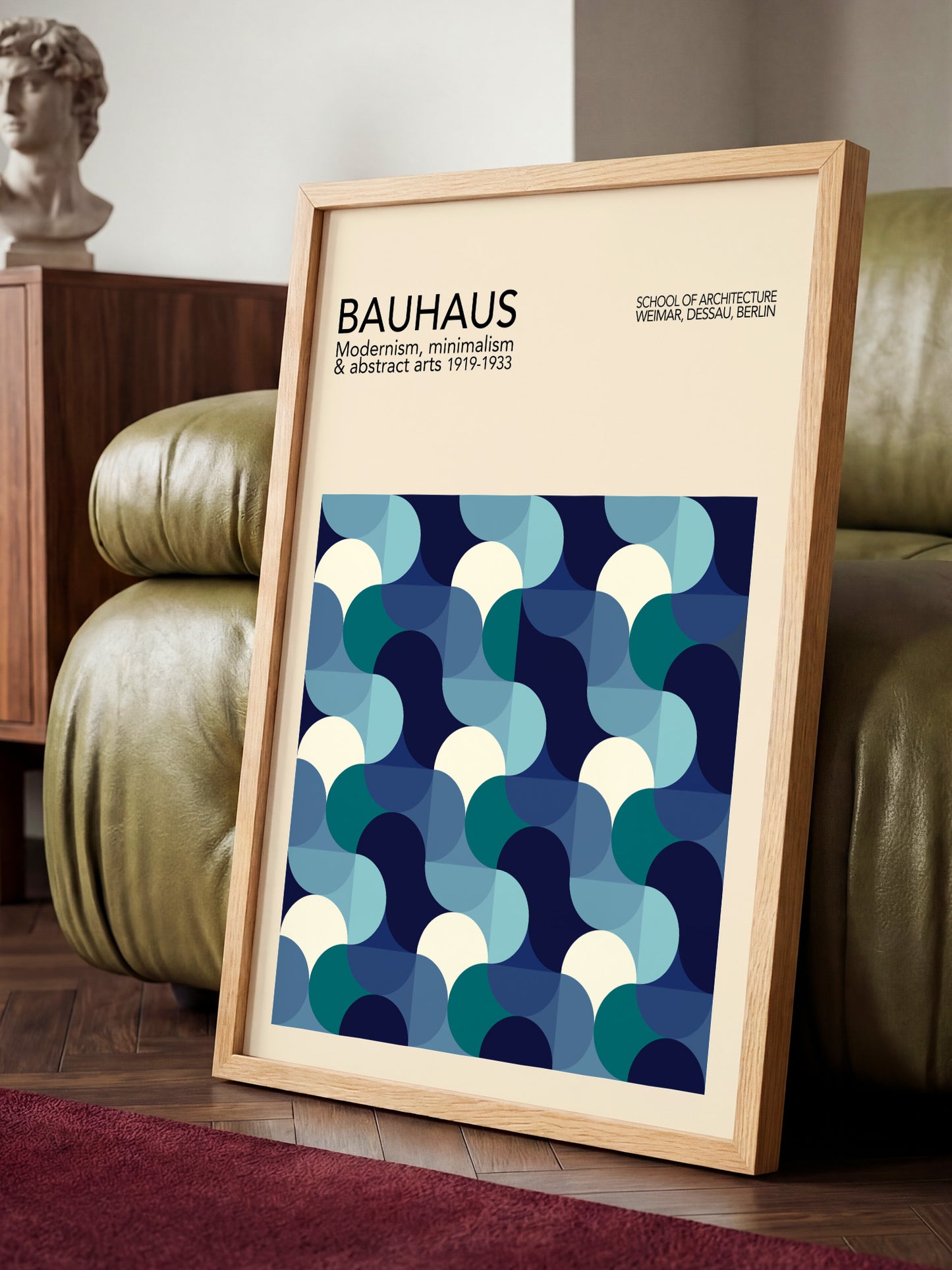 a framed poster of the Bauhaus school of architecture, showcasing a geometric pattern in shades of blue and white.