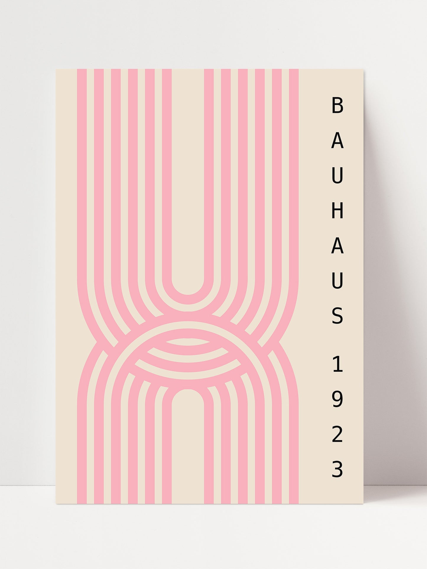 The image is a poster for the Bauhaus exhibition, featuring a minimalist design with a repeating pattern of pink and beige stripes.