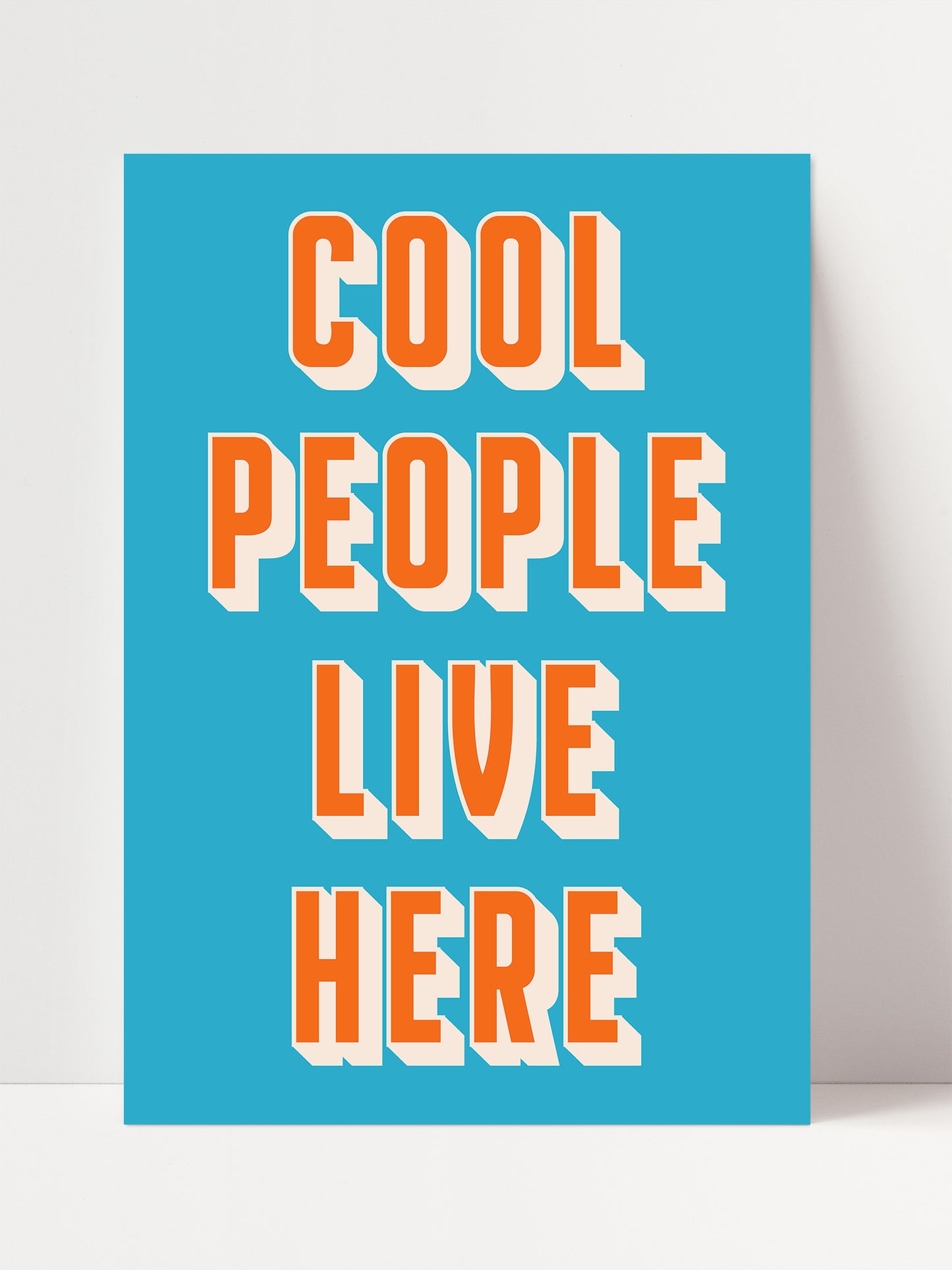 a bright blue background with bold orange text that reads "COOL PEOPLE LIVE HERE".
