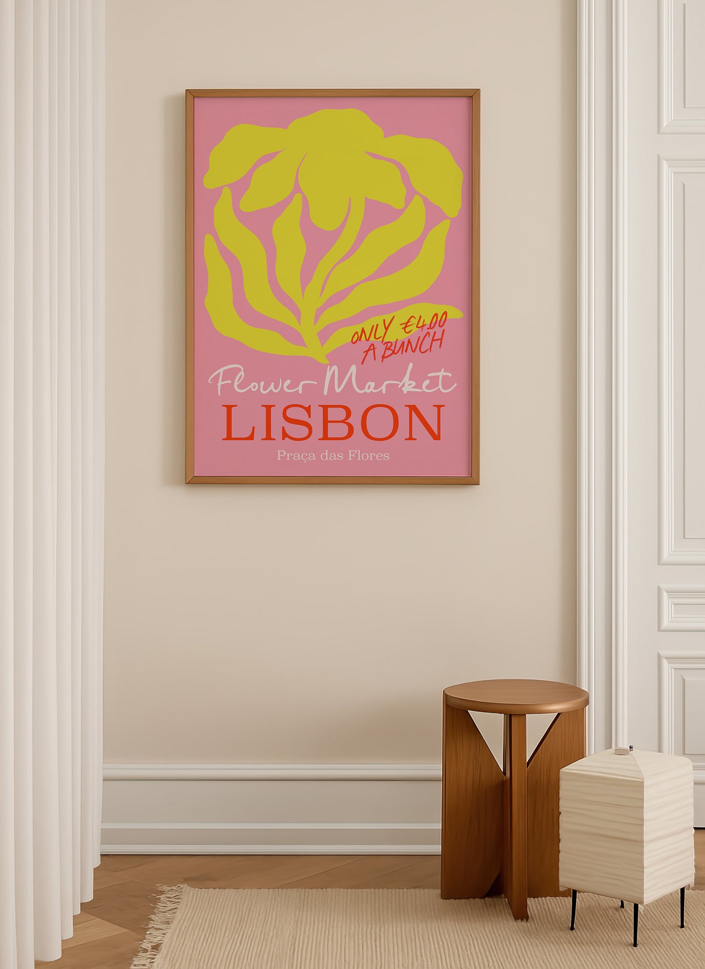 a framed poster of a flower market in Lisbon hanging on a wall.