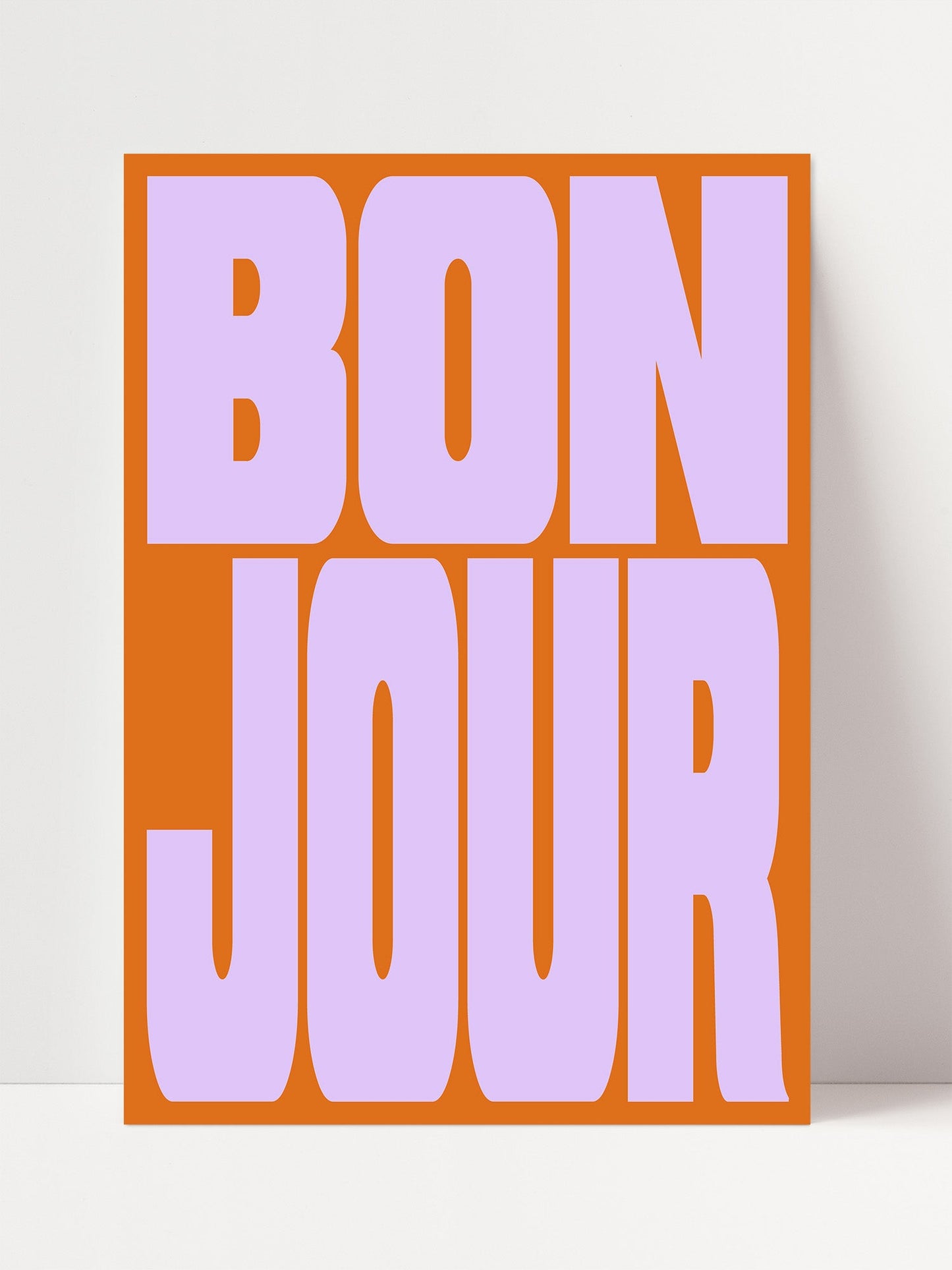 a large, bold, and colorful text that reads " bon jour".