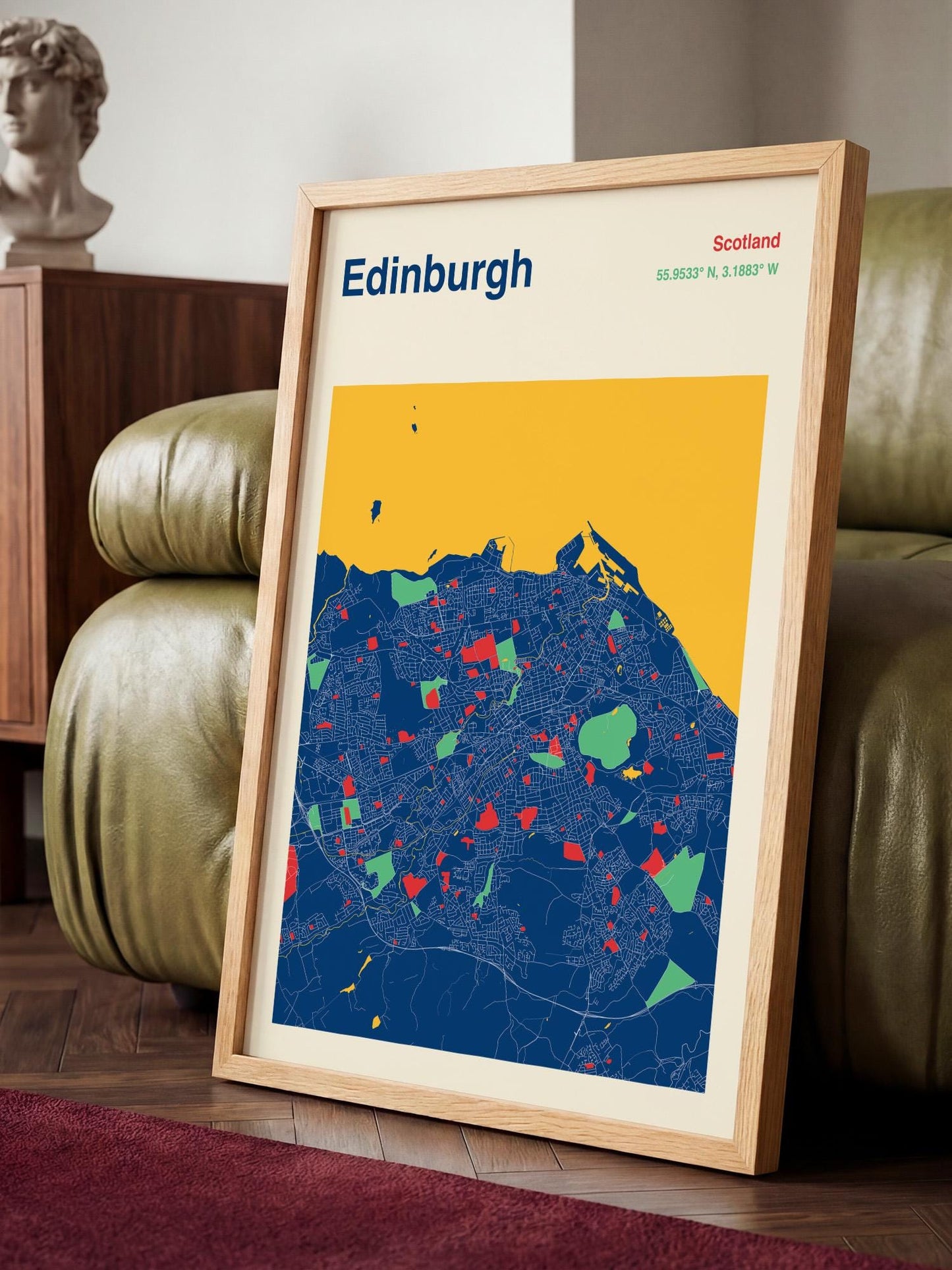A framed map of Edinburgh, Scotland, with a colorful and detailed representation of the city's streets and landmarks.