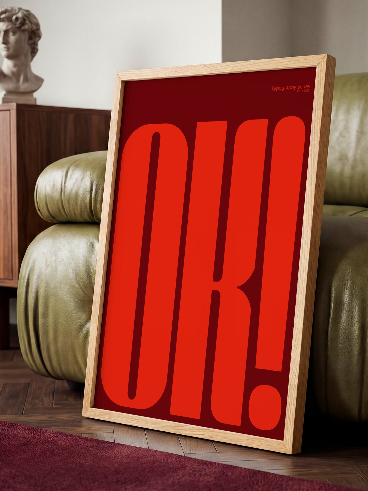 A large red "OK!" sign is displayed in a wooden frame, standing on a wooden floor in a room with a green couch.