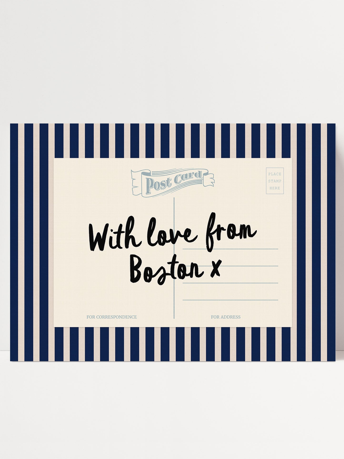 A postcard with a striped border and a handwritten message that reads "With love from Boston x".