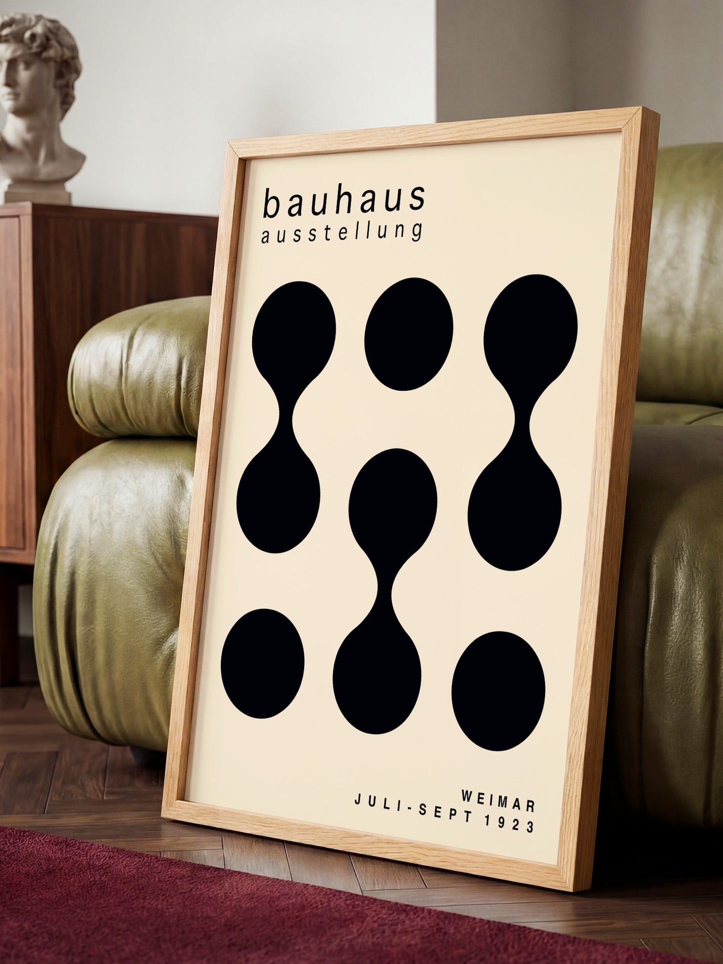 a minimalist poster of the Bauhaus art school, with a simple design of black circles on a beige background.