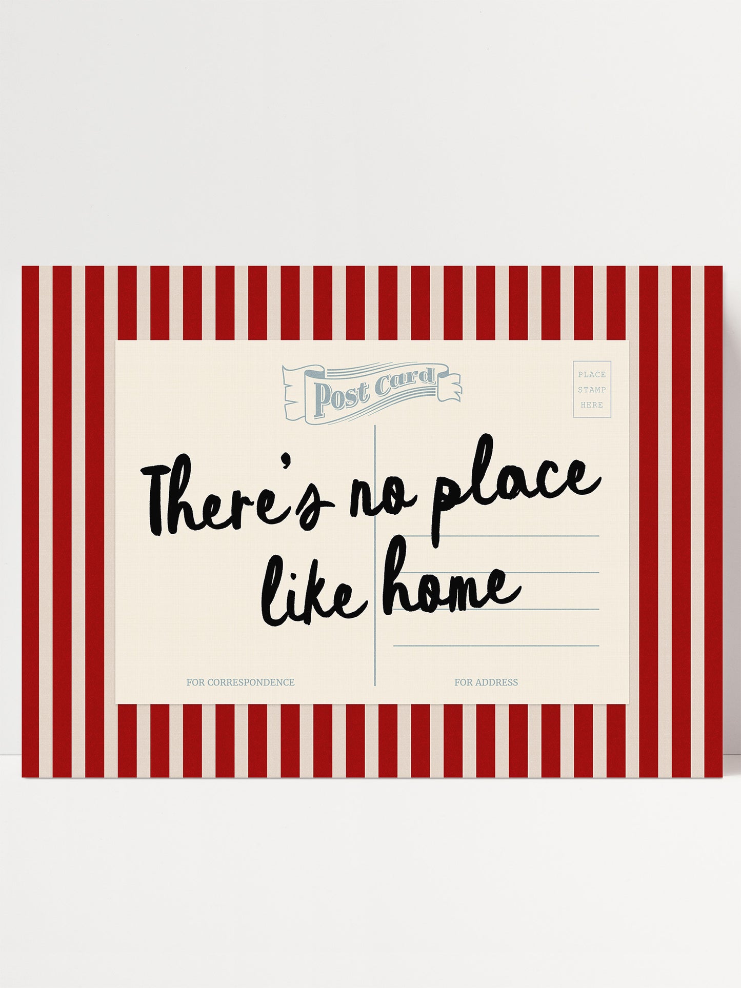 The image is a postcard with a red and white striped border. The postcard has a message that reads "There's no place like home" in black cursive text.