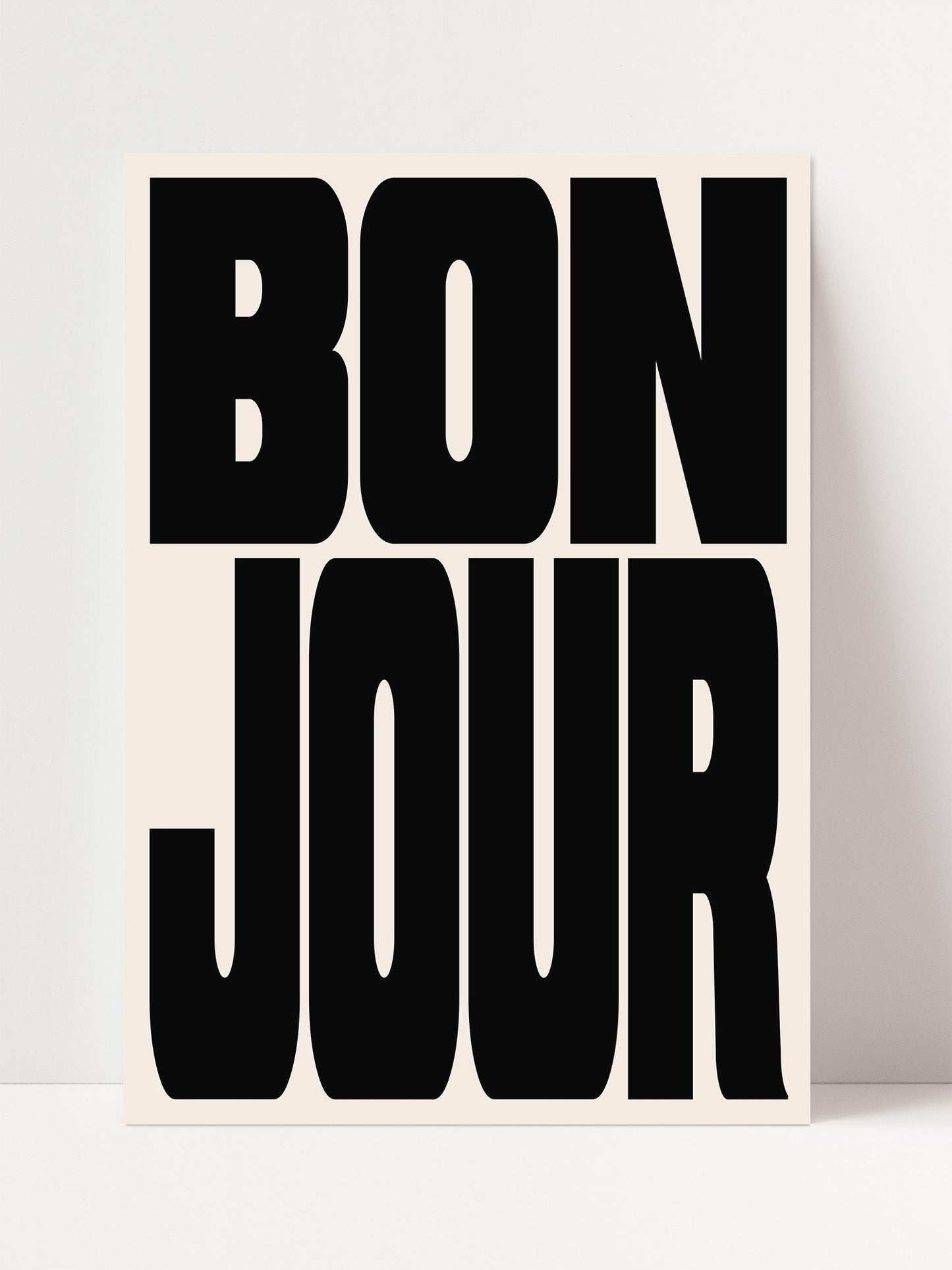a large, bold, black text that reads " bon jour".