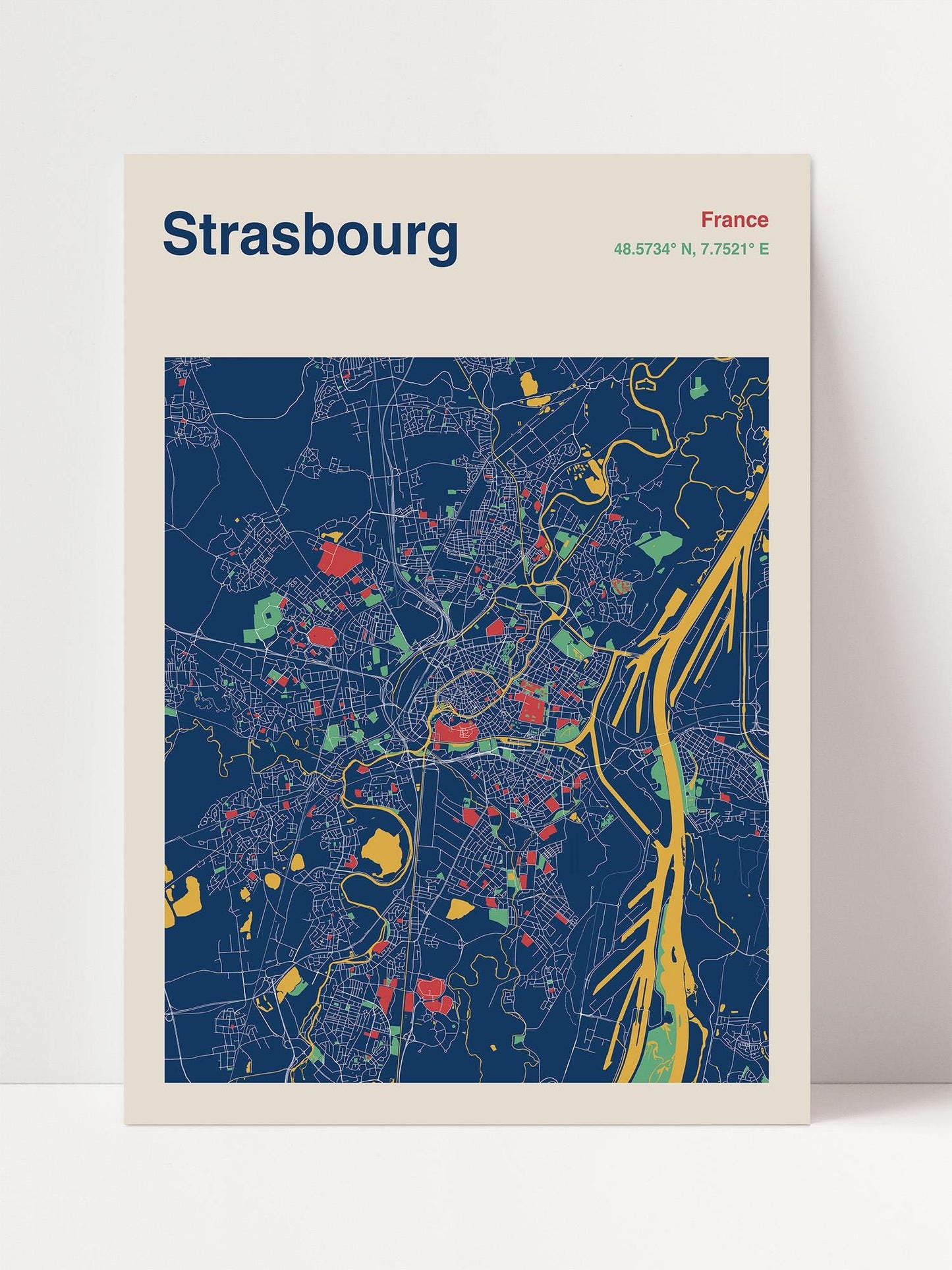 The image is a colorful map of the city of Strasbourg, France, depicting the city's streets, landmarks, and other features in a stylized and vibrant manner.