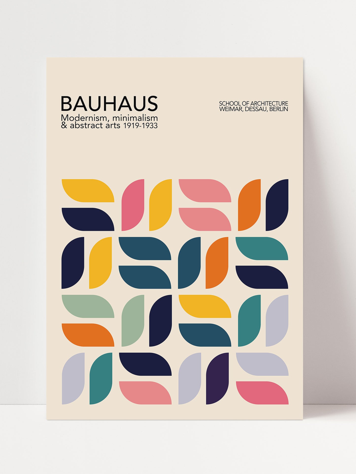 The image is a poster for the Bauhaus School of Architecture in Berlin, featuring a geometric design with colorful shapes and patterns.