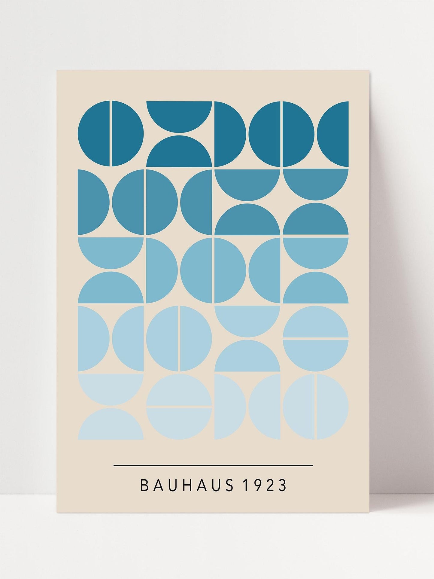 The image is a poster featuring a repeating pattern of blue circles and ovals, with the text "BAHAU 1923" below the design.