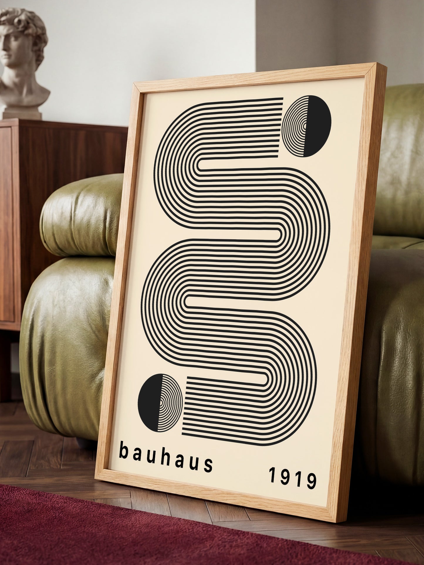 a framed poster with a minimalist design, including a black and white abstract pattern and the text "bauhaus 1919".