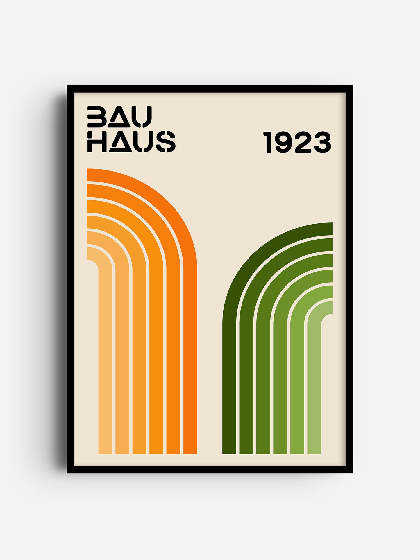 The image is a framed poster featuring the text "BAU HAUS 1923" and two abstract geometric designs, one with orange lines and the other with green lines.