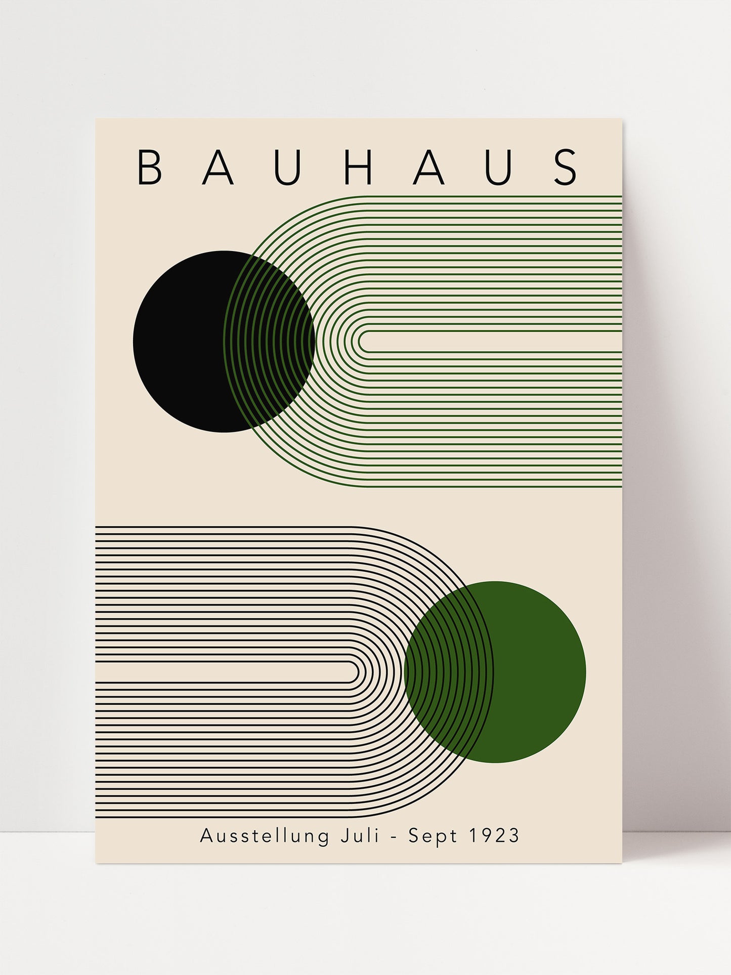 The image is a poster for the Bauhaus exhibition in 1923, featuring abstract geometric designs in shades of green and black.
