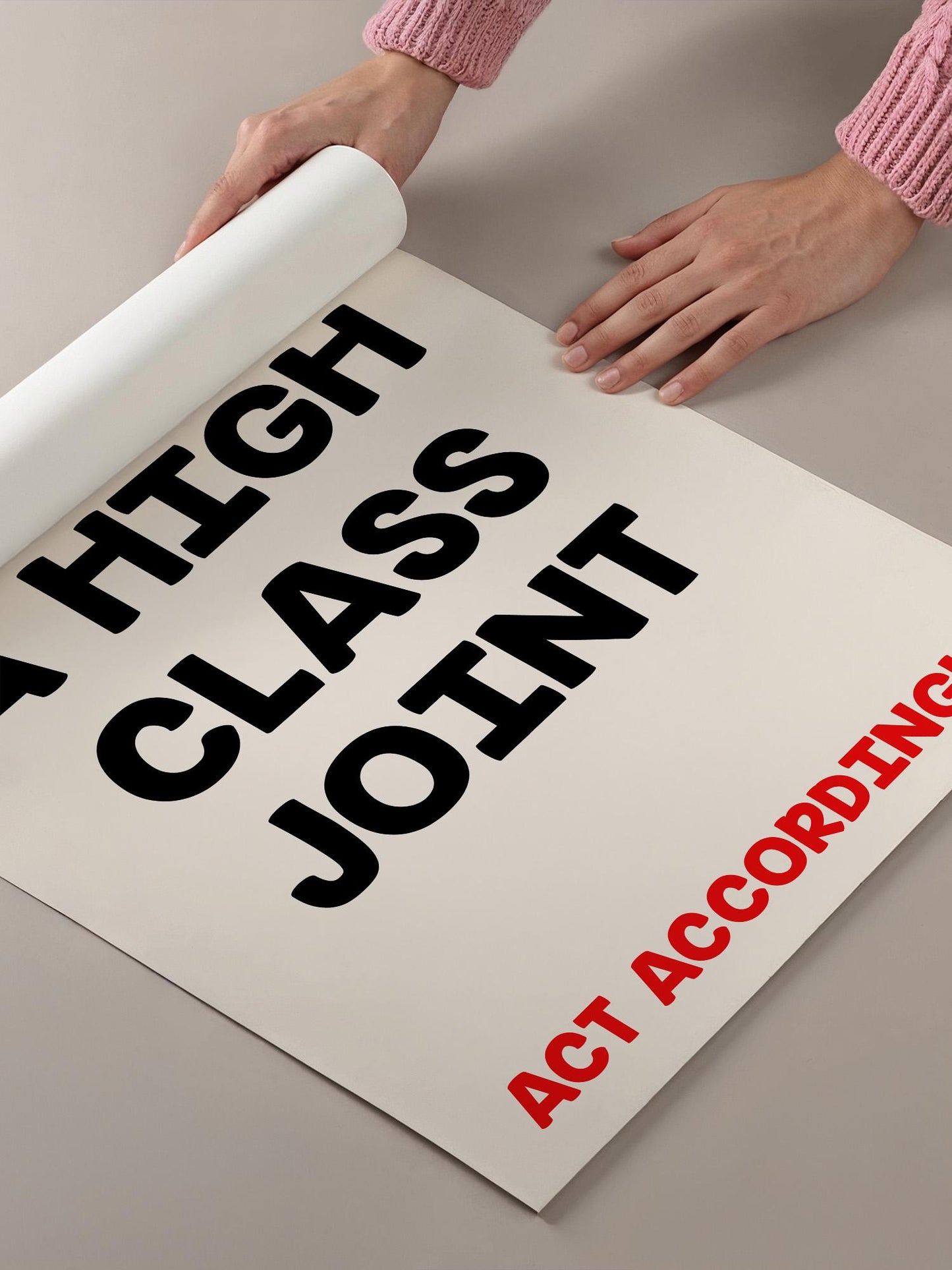 A person's hands are holding a roll of paper with the text "A HIGH CLASS JOINT" printed on it.