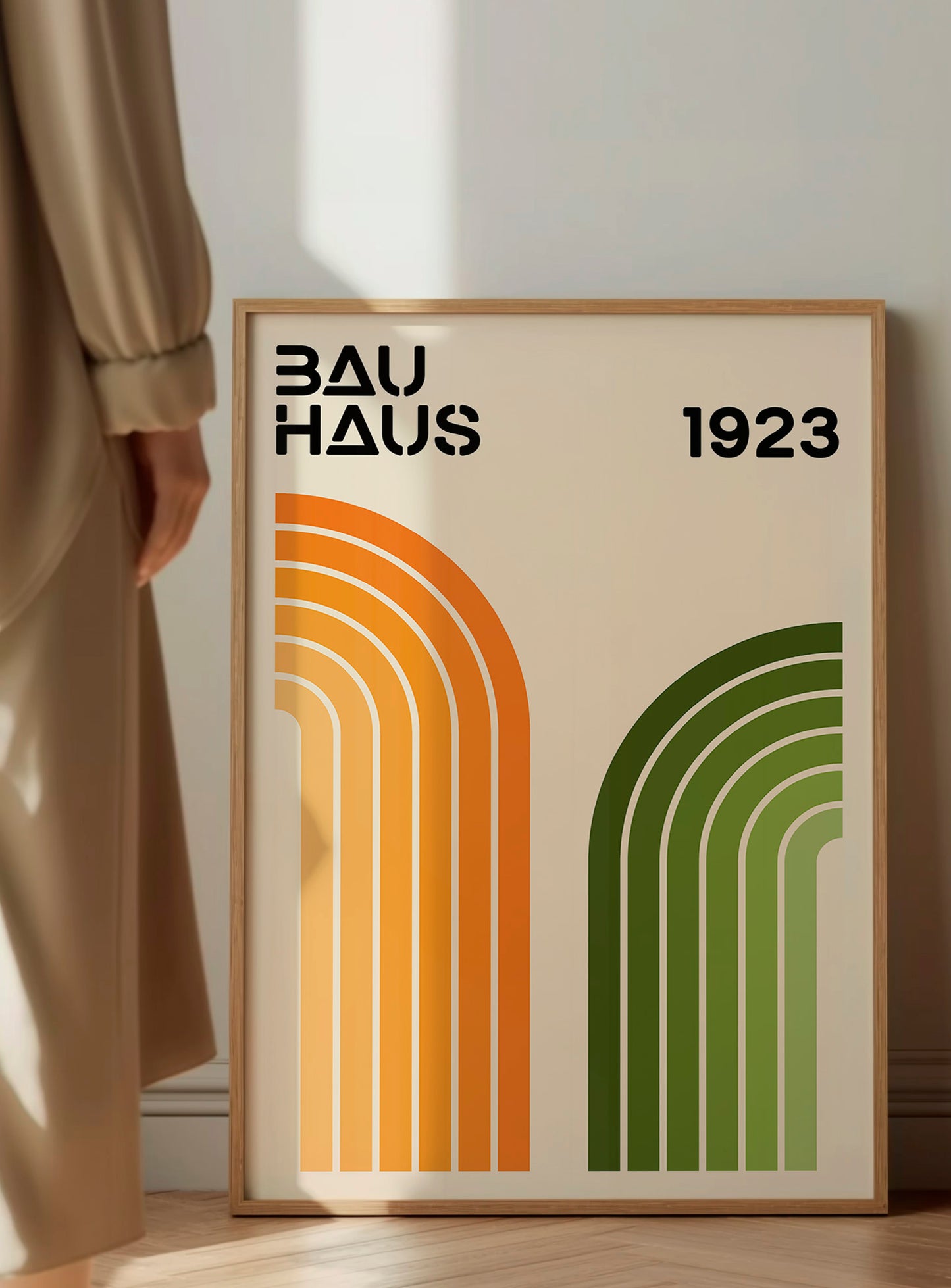 a poster with the text "BAU HAUS 1923" and two abstract geometric designs in orange and green.