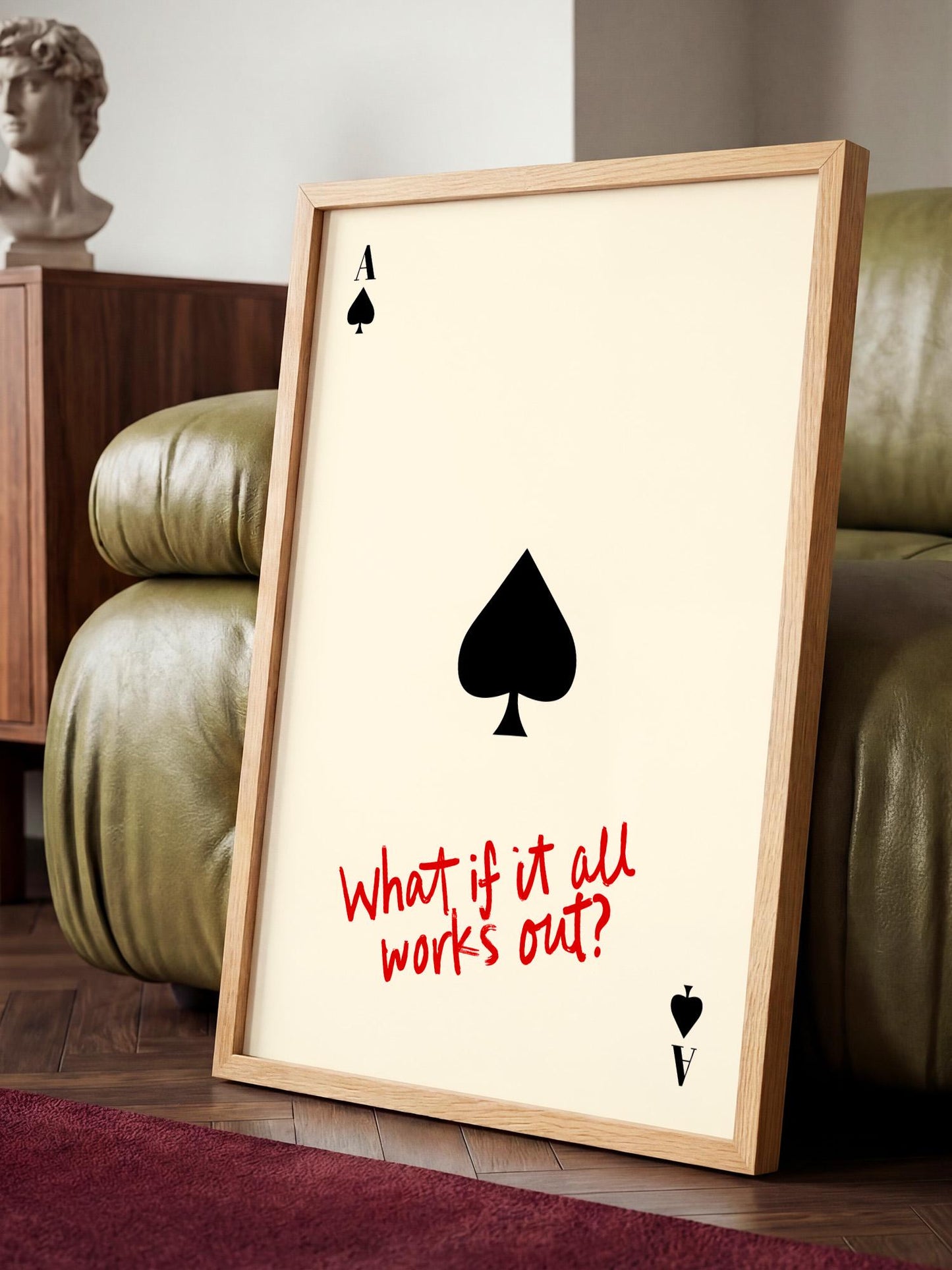 a framed poster with a spade symbol and the text "What if it all works out?" displayed on it.