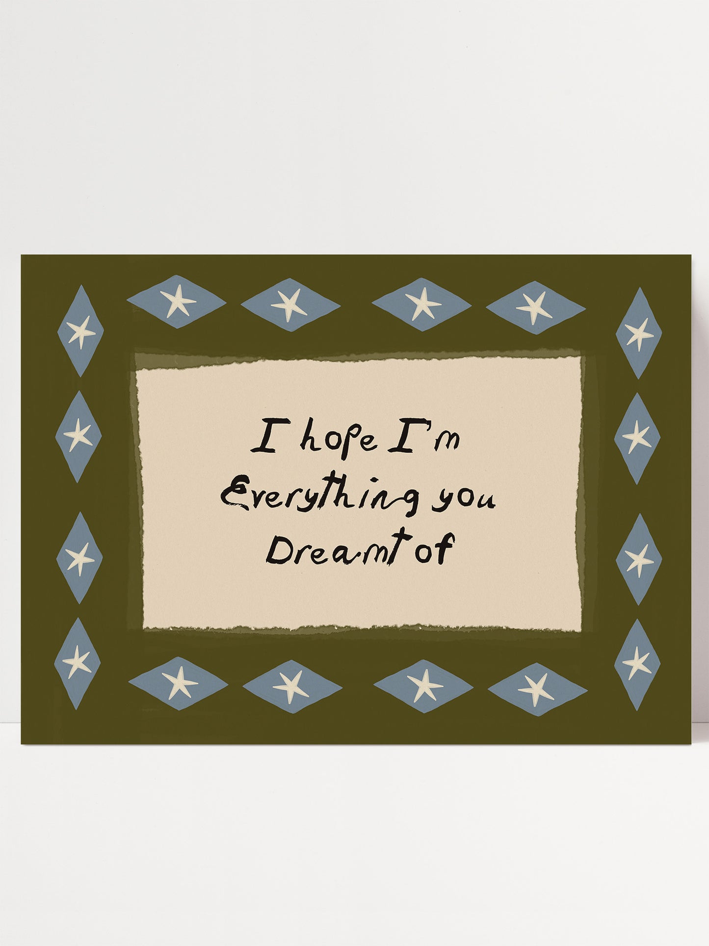 a framed message with a green background and a border of blue diamond shapes. The message reads "I hope I'm Everything you Dreamt of".