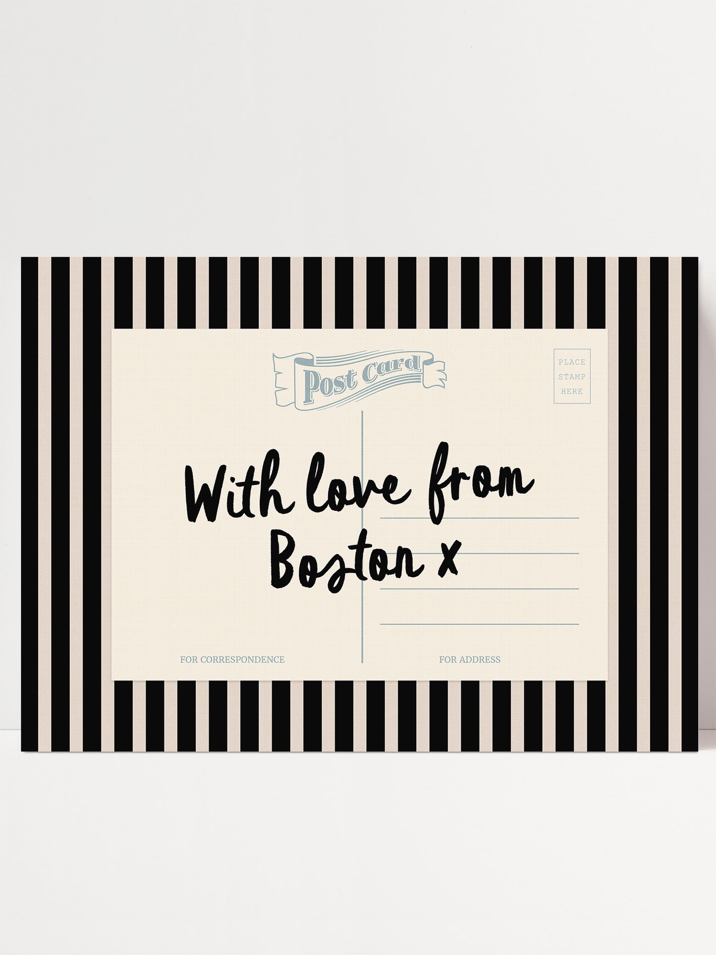 A postcard with a black and white striped border, featuring handwritten text that reads "With love from Boston x".