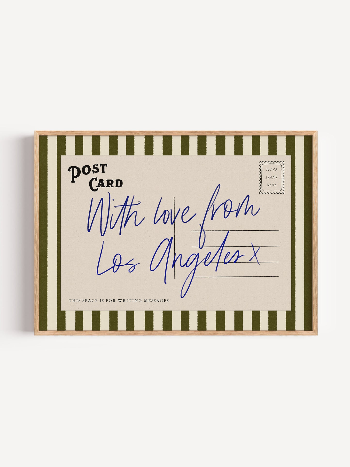 A framed postcard with handwritten text that reads "With love from Los Angeles x", indicating a message from Los Angeles.