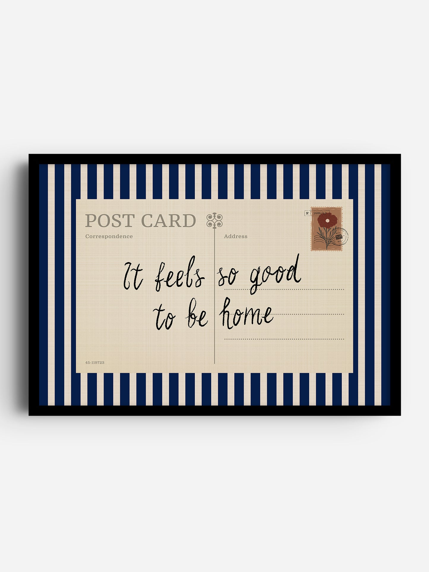 The image is a framed postcard with a handwritten message that reads "It feels so good to be home".