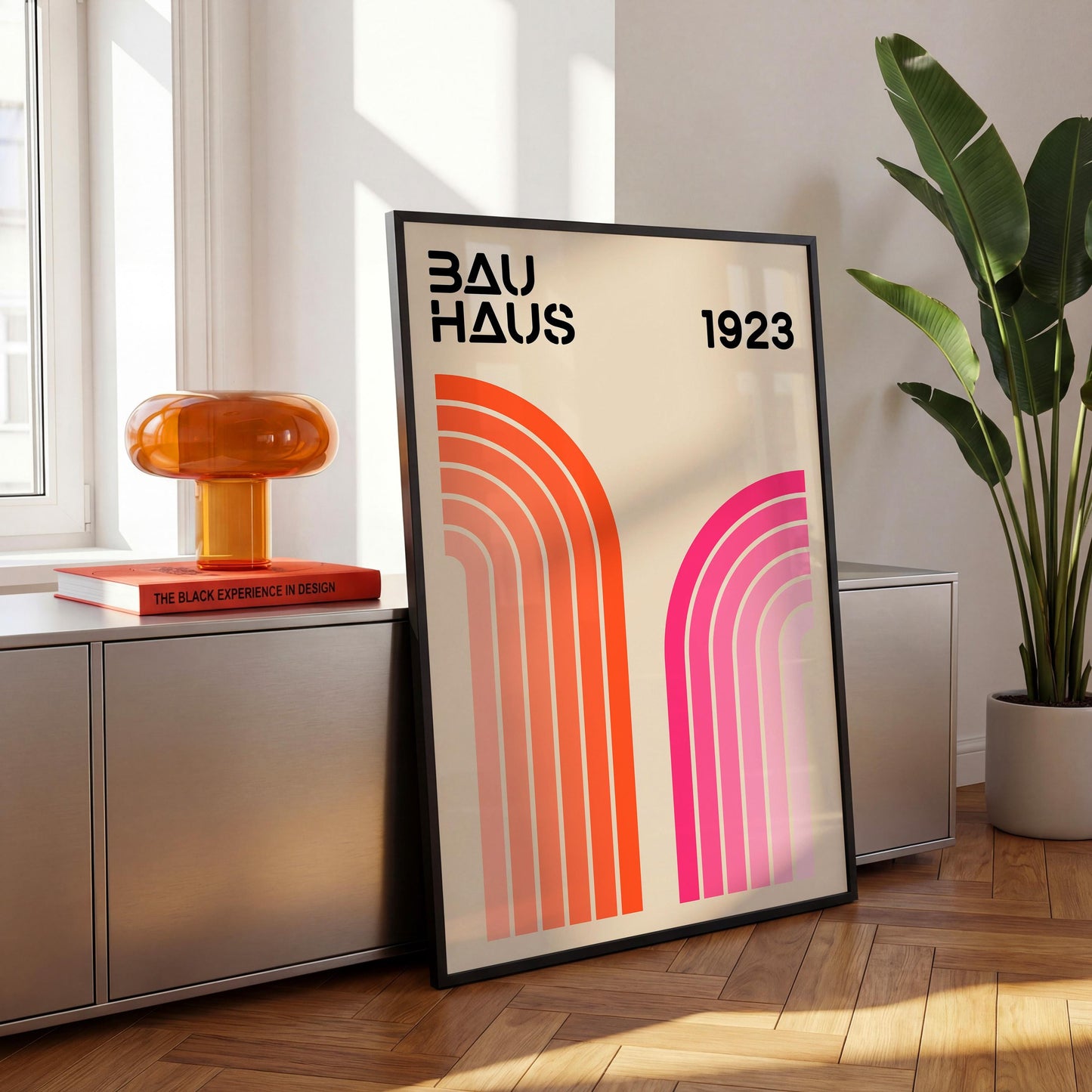 a poster of Bauhaus, a famous art school, with a large orange lamp and a plant in the background.