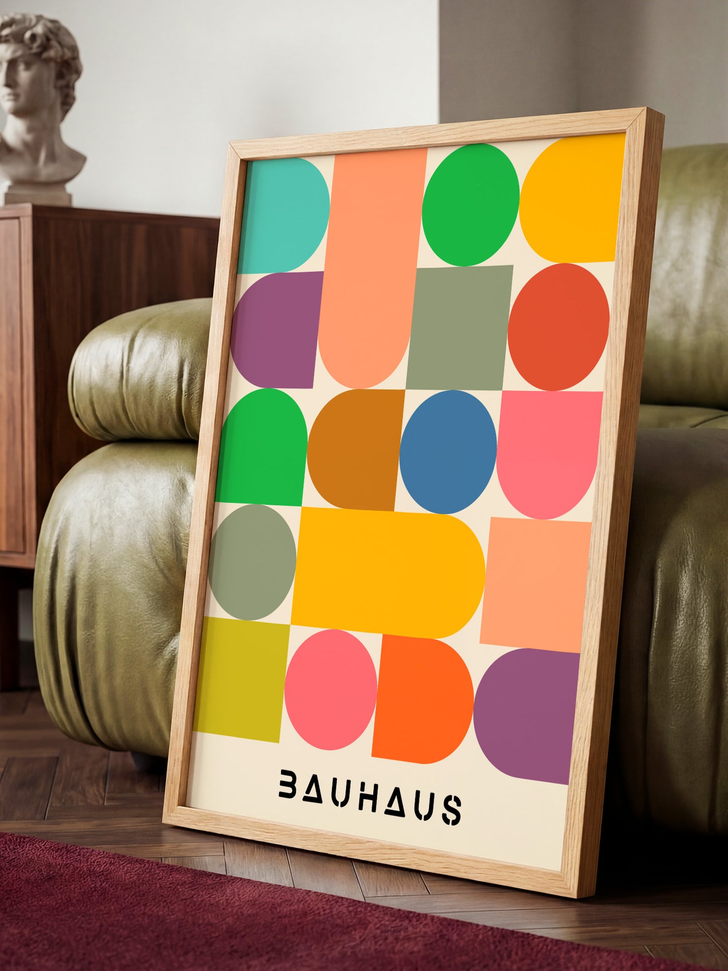 a colorful abstract art piece with a geometric design, displayed on a wooden stand in a room with a green leather couch.