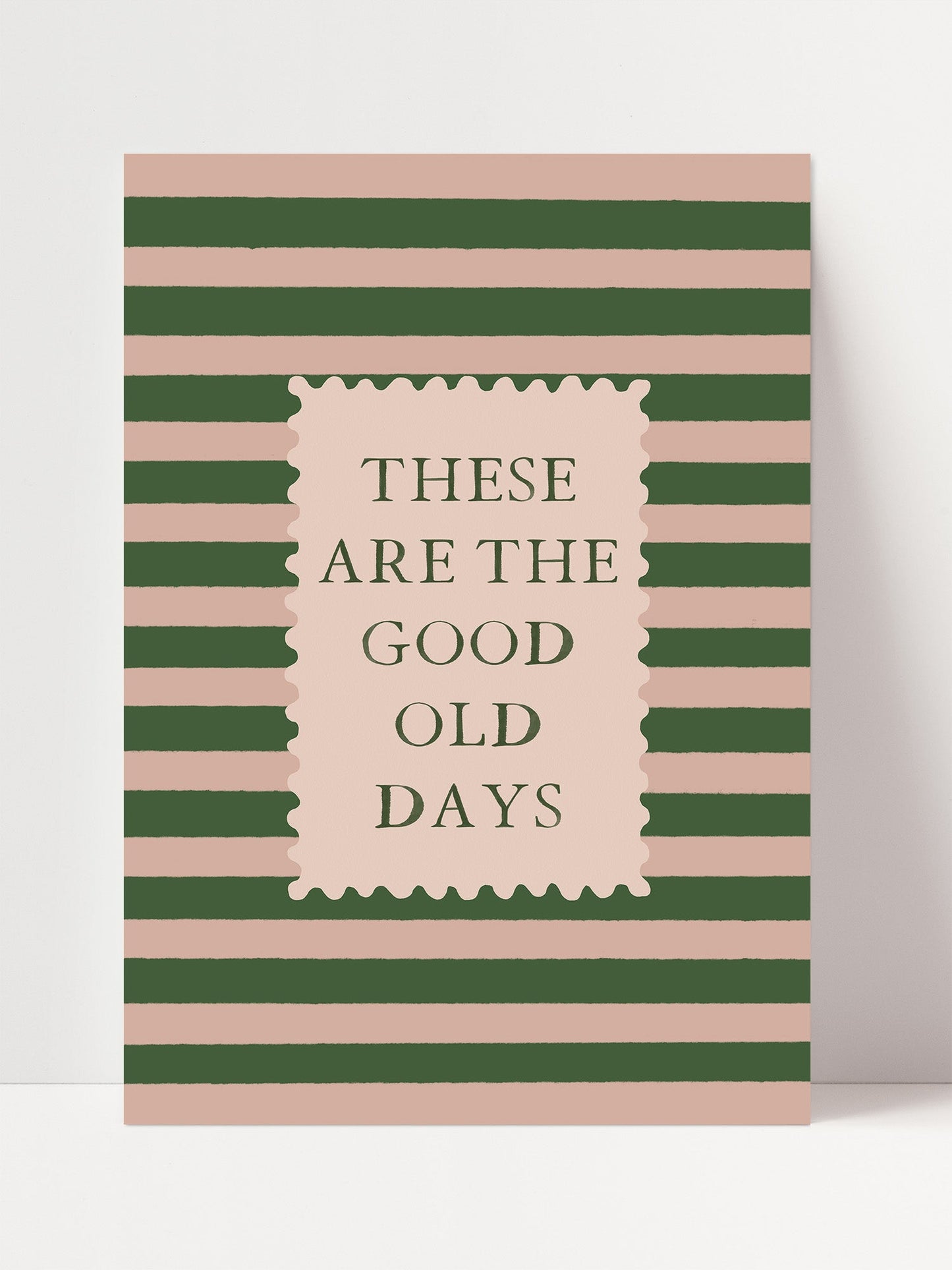 The image is a poster with a striped background and a rectangular frame containing the text "These are the good old days".