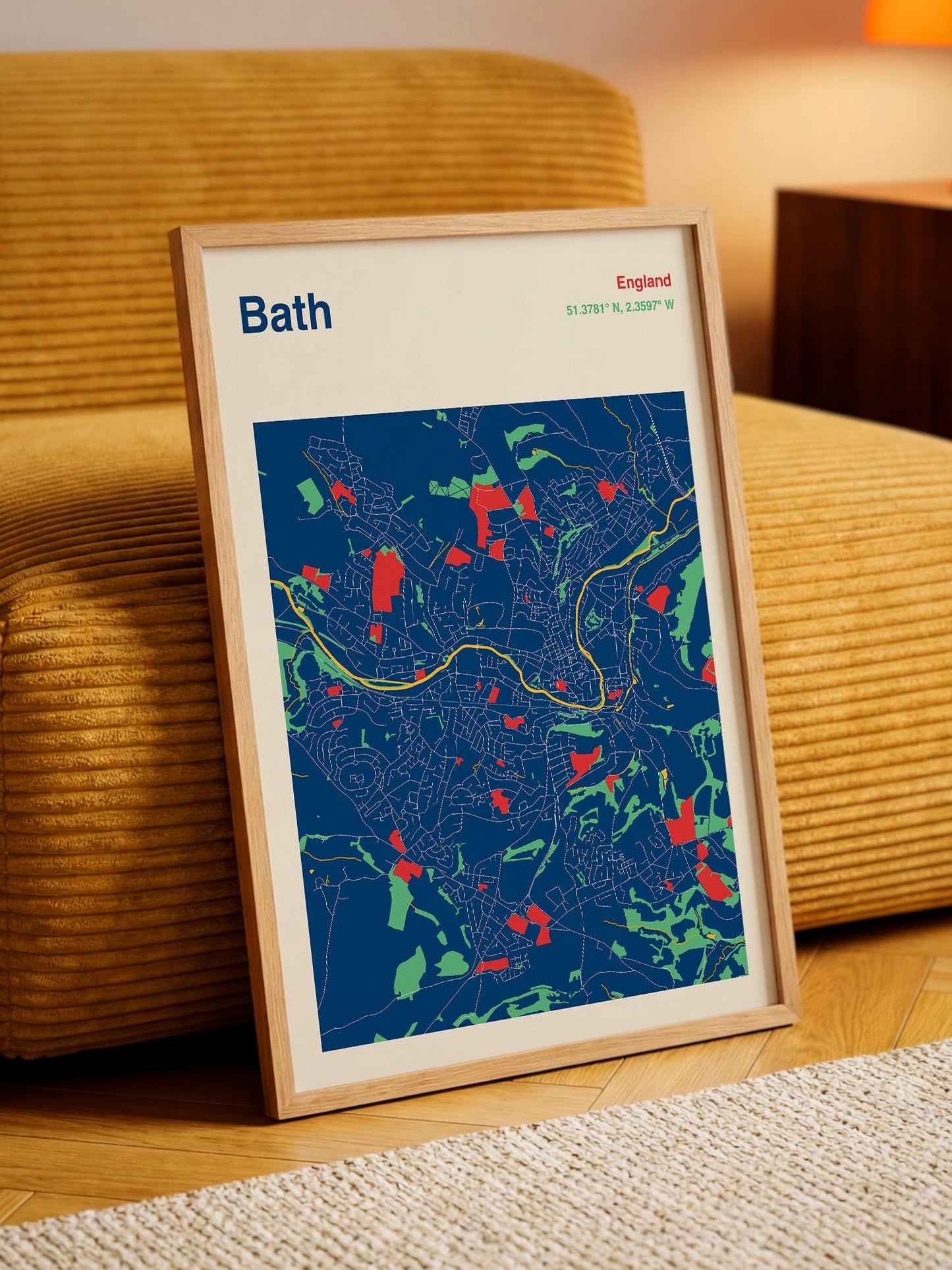 A framed map of Bath, England, with a colorful and detailed representation of the city's streets and landmarks.