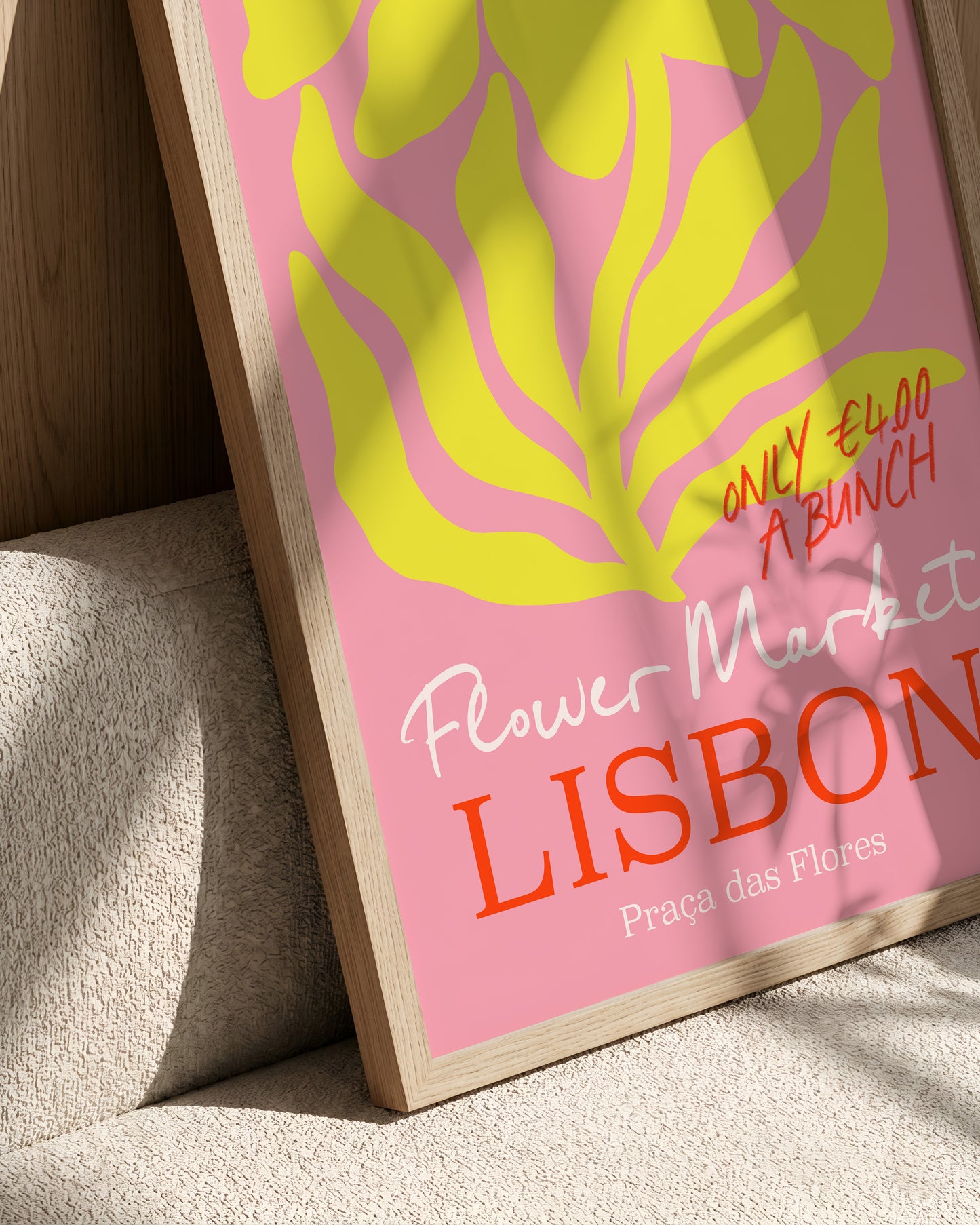 A framed poster advertising a flower market in Lisbon, Portugal.