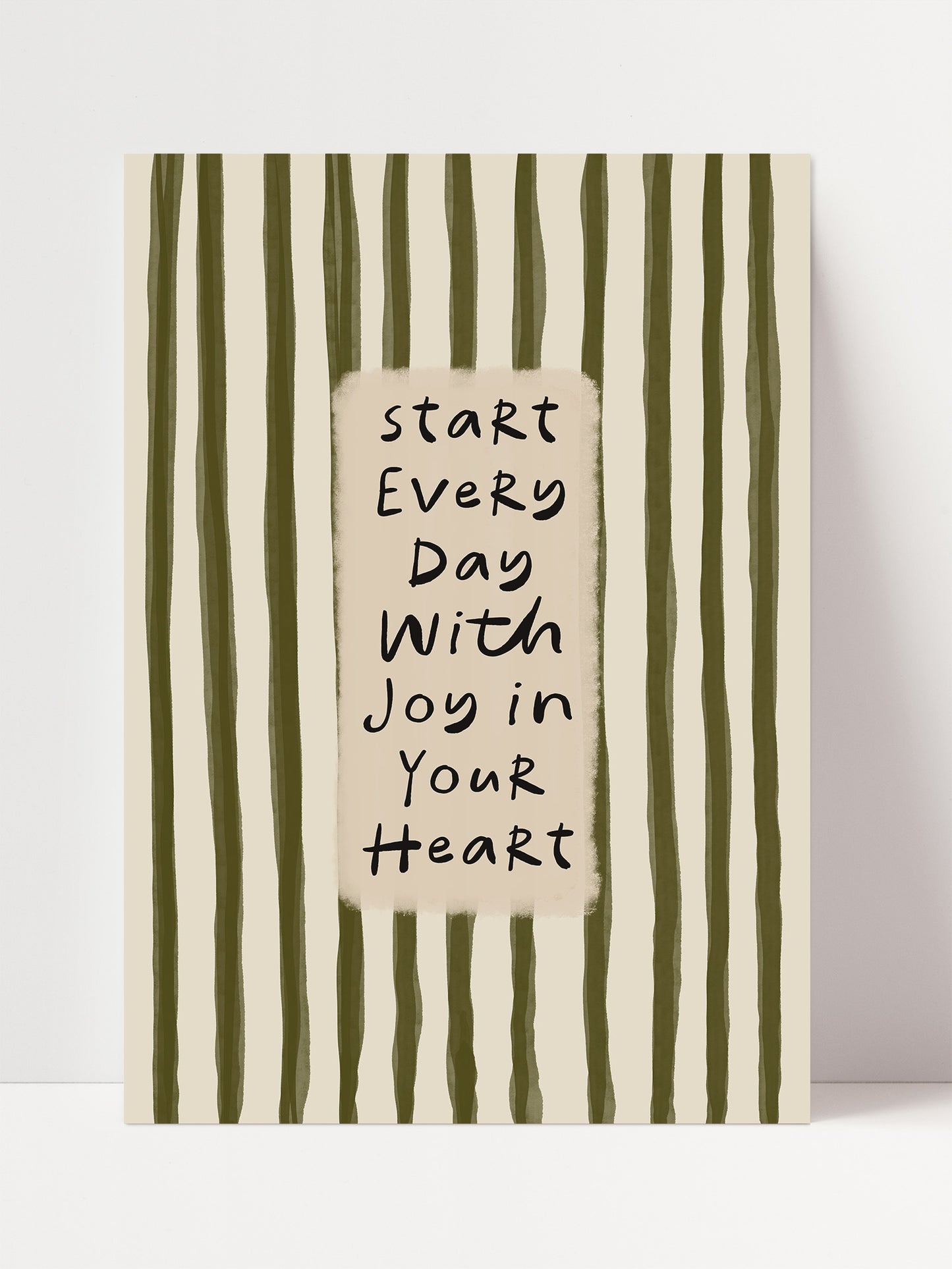 a motivational quote in black text that reads "Start Every Day With Joy in Your Heart".