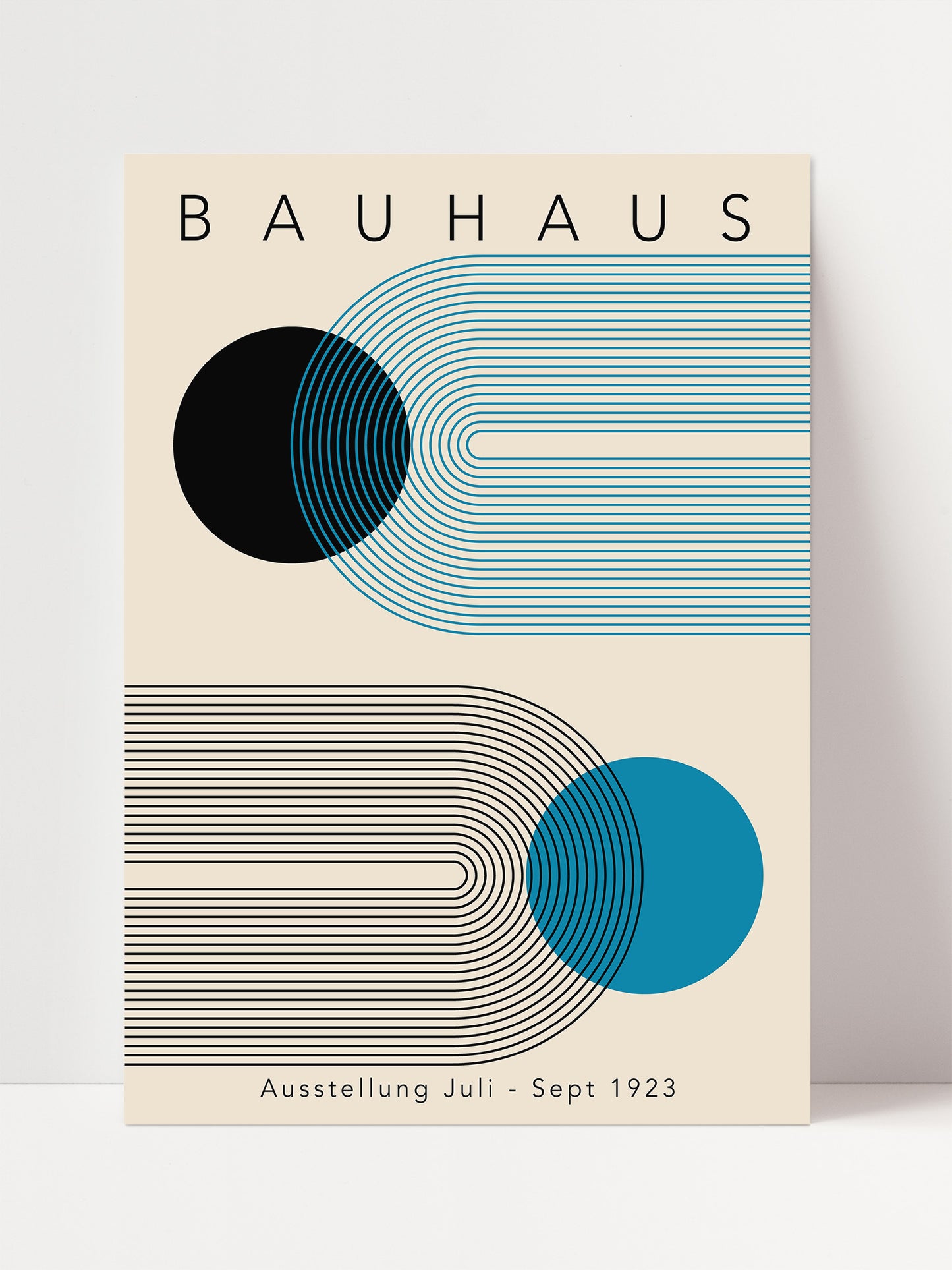 The image is a poster for the Bauhaus exhibition in 1923, featuring abstract geometric designs in shades of blue and gray.